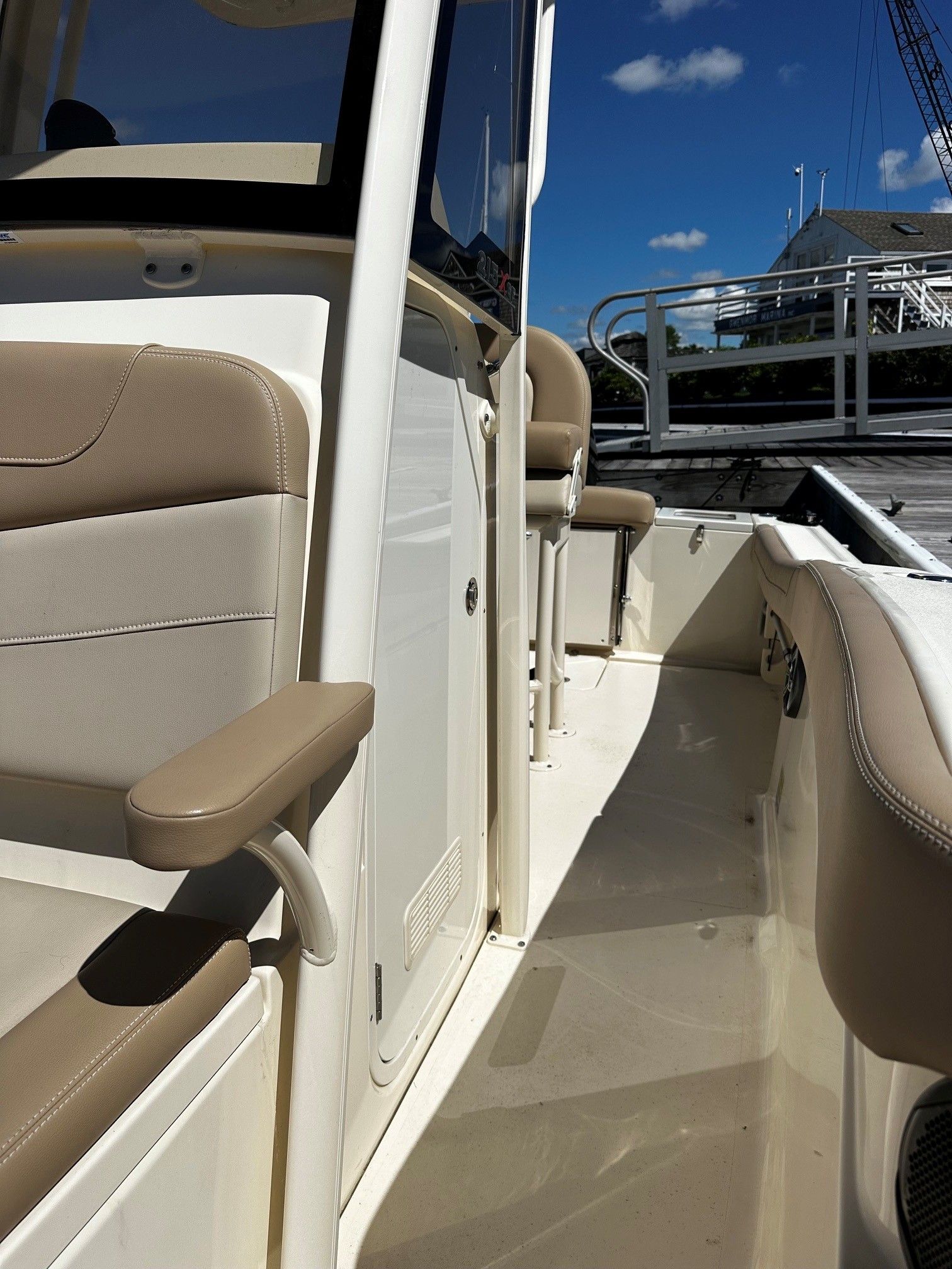 Scout 210XSF 2022 boat, interior view with beige seats.