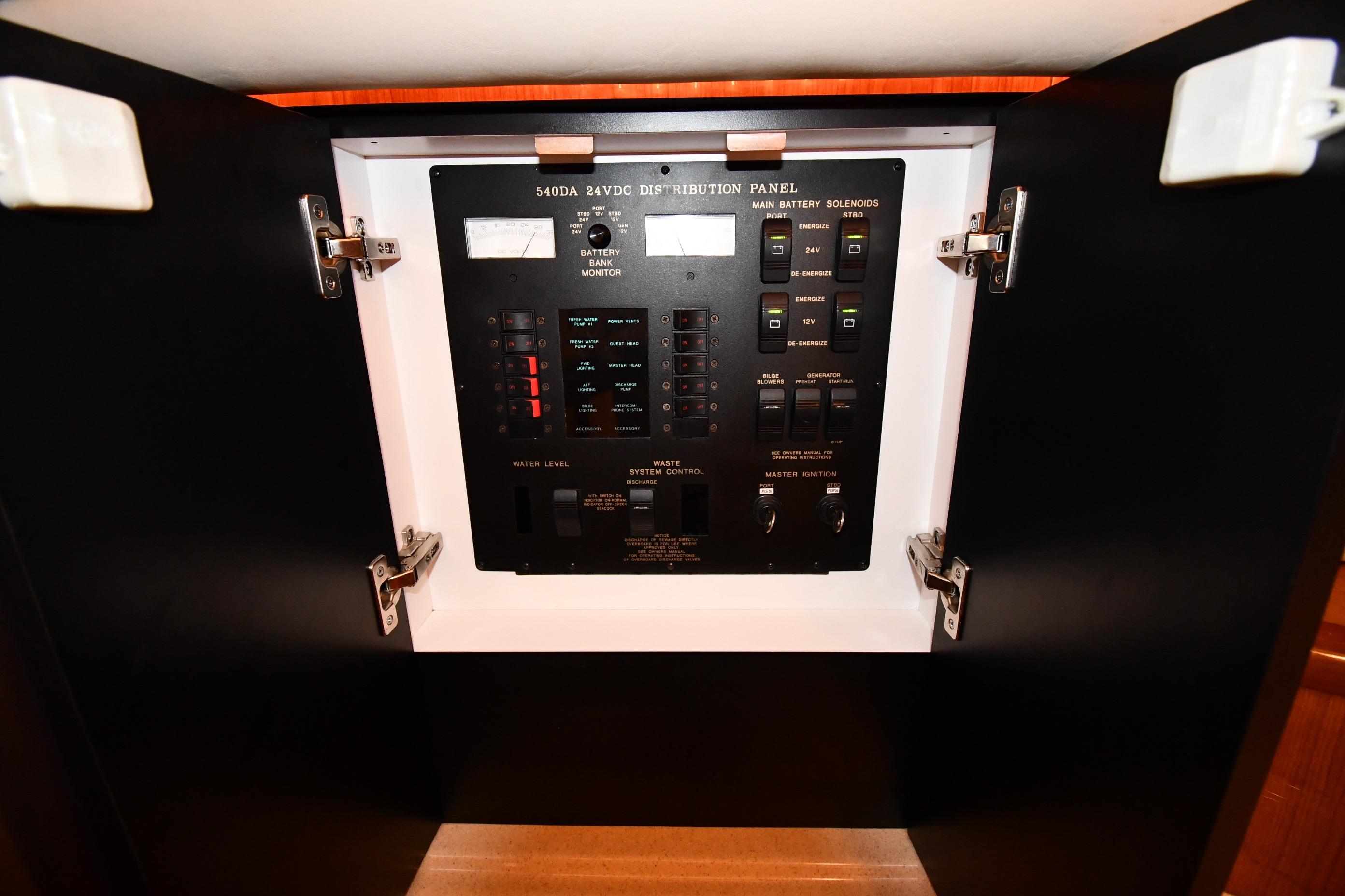 Electrical distribution panel on 2001 Sea Ray 540 Sundancer yacht, showcasing controls and switches.