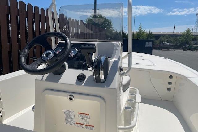 2026 Mako 18 Pro Skiff boat interior with steering wheel and console.
