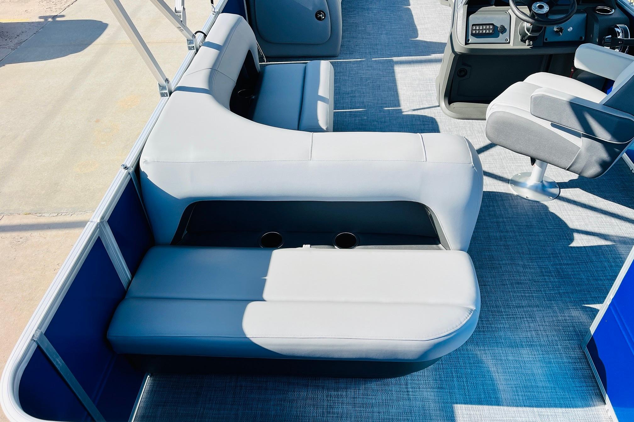 2026 Sun Tracker Party Barge 18 DLX interior with seating and helm.
