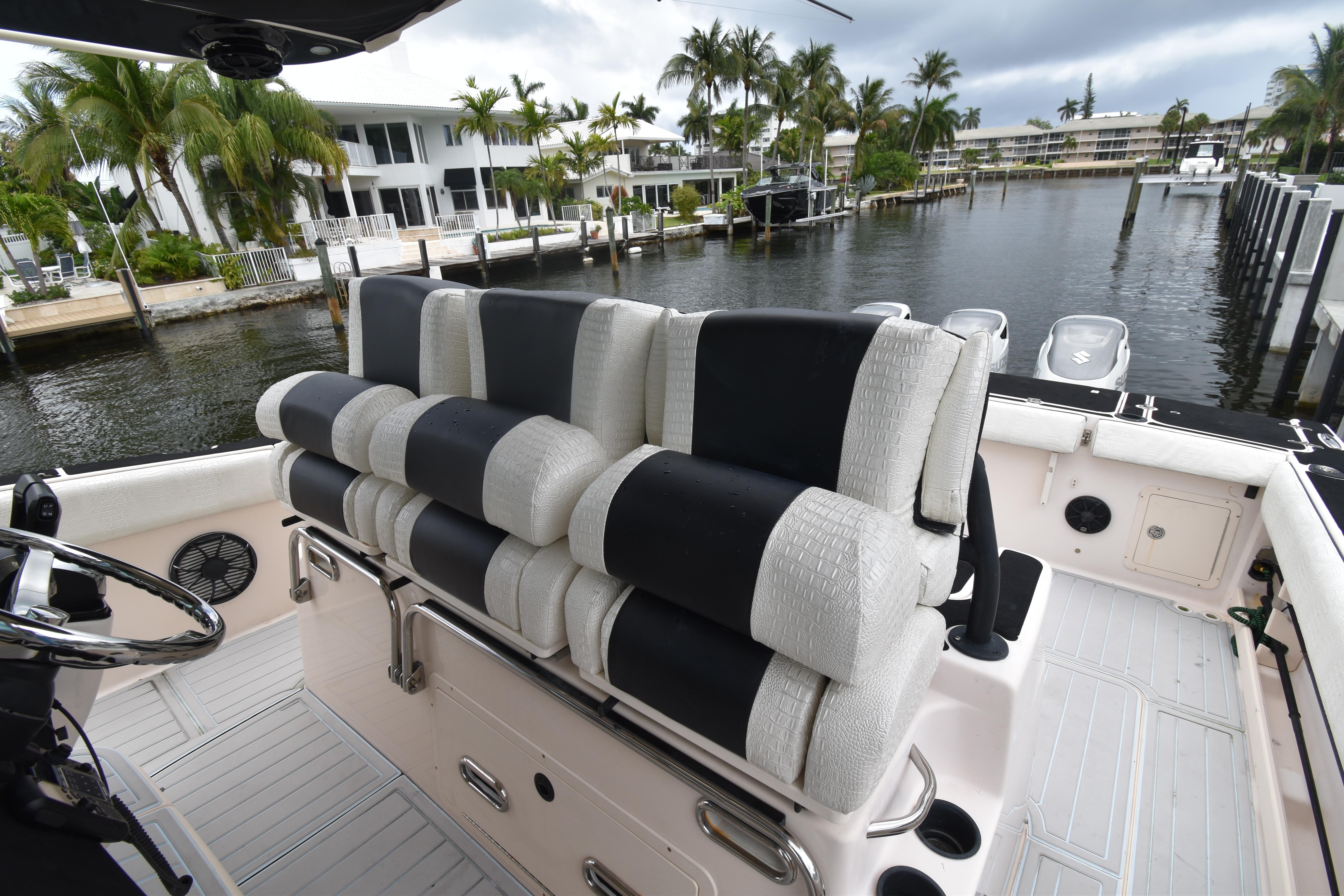 2010 Grady-White Canyon 366 boat interior with cushioned seating, dockside view.
