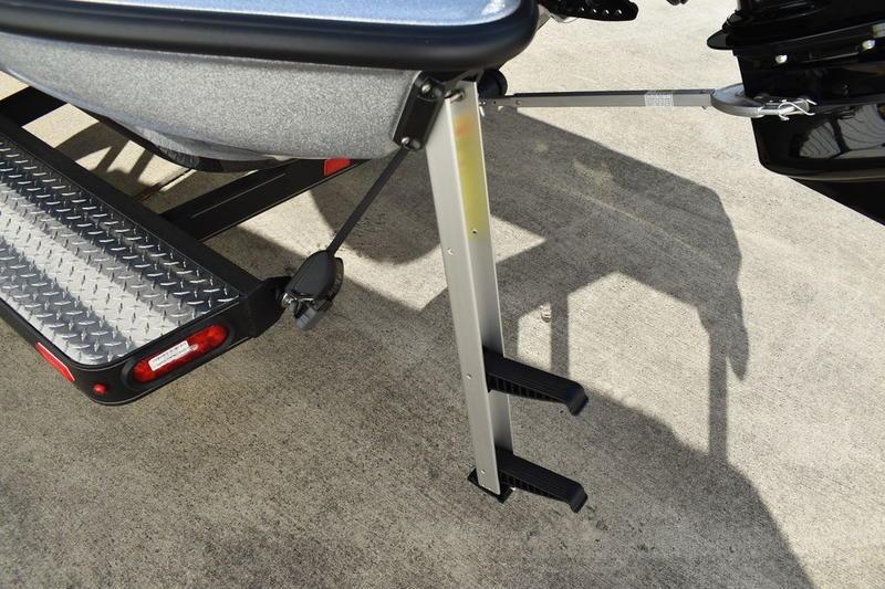 2026 Triton 179 TrX boat trailer with step ladder and diamond plate detail.