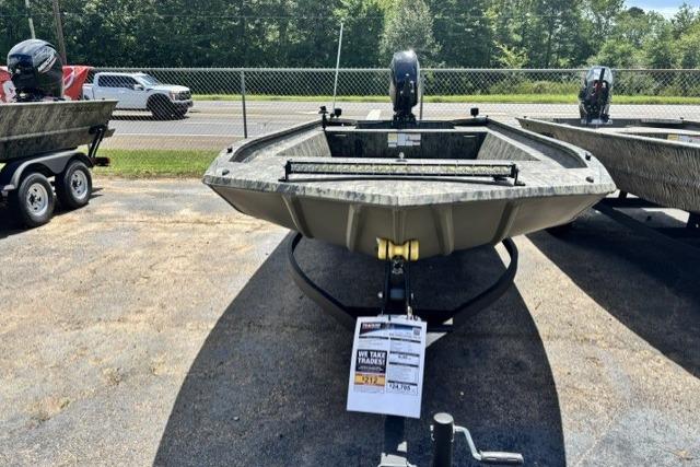 2026 Tracker Grizzly 1860 Utility boat displayed outdoors, showcasing its robust design and trailer.