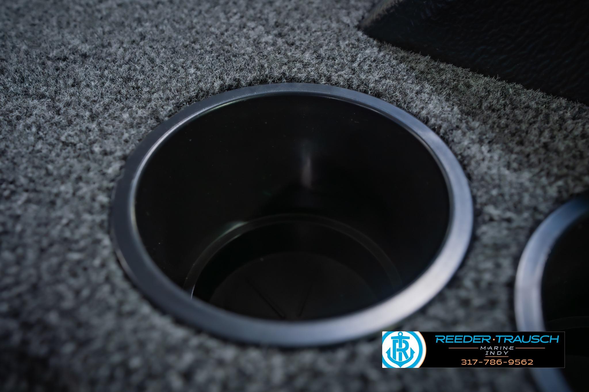 Cup holder on 2026 Lund 1875 Impact XS boat with carpeted surface.