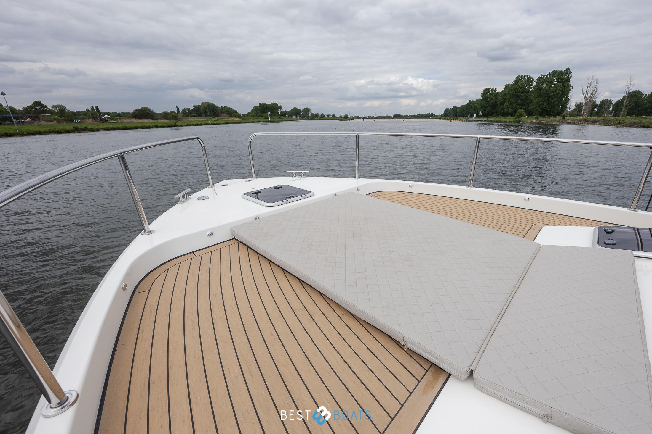 2023 Cobra Yachts Futura 36 Premium Fly deck with scenic river view.