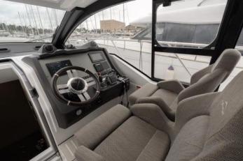 2019 Azimut Atlantis 51 yacht cockpit with modern steering and navigation controls.