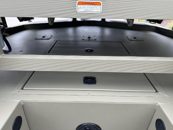2025 Tracker Grizzly 2072 CC Sportsman boat interior with storage compartments.
