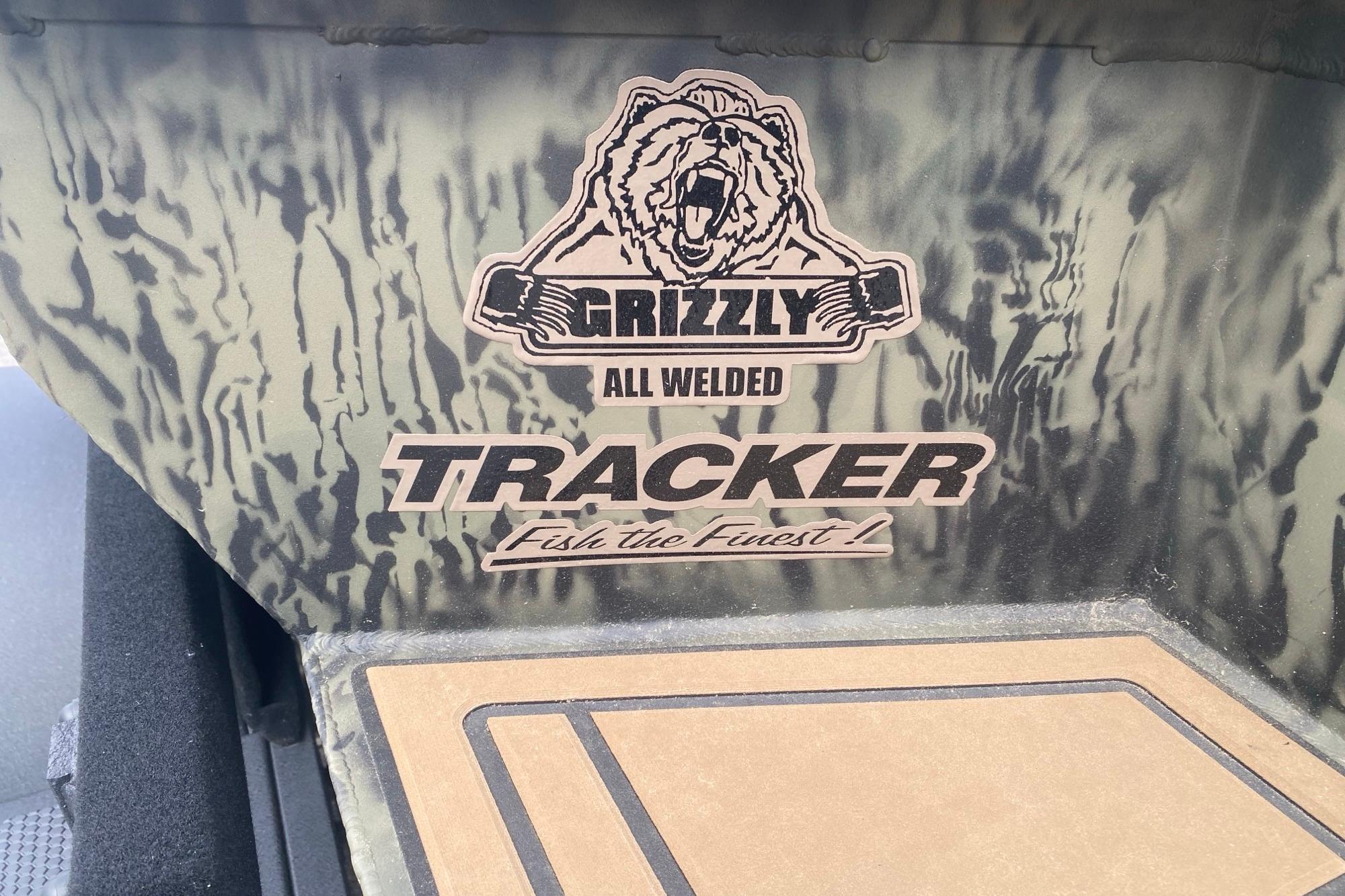 2026 Tracker Grizzly 1650 T Prairie Wings Edition boat interior with logo and camouflage design.