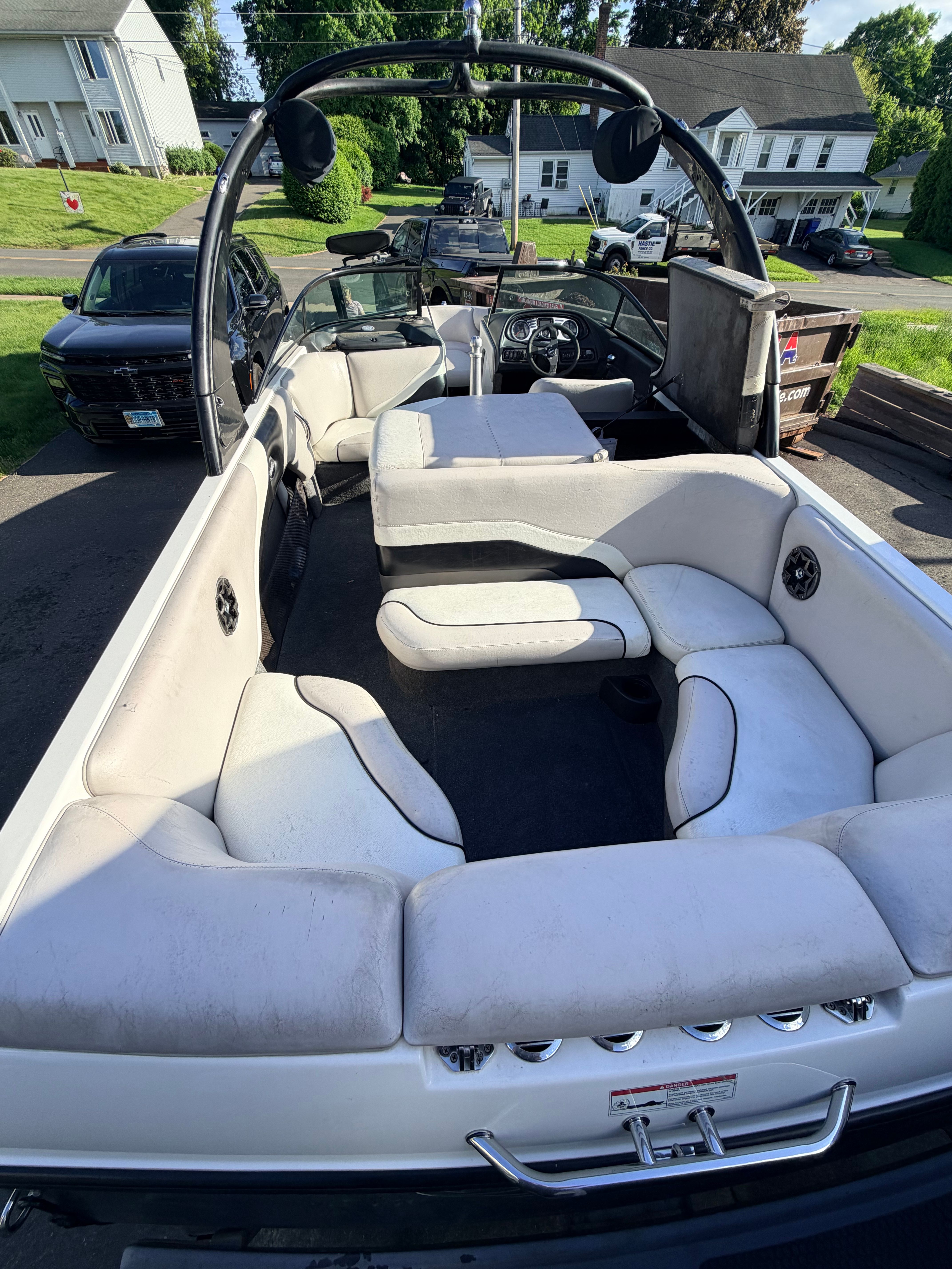 Interior view of a 2006 Malibu iRide boat with white seating.