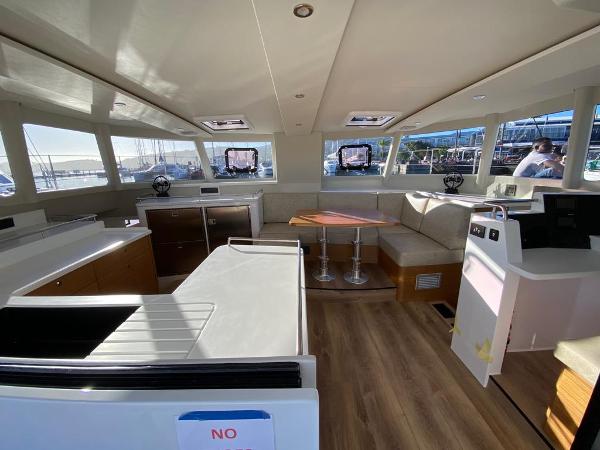 Interior of Vision 444 yacht, 2025 model, featuring modern design and spacious seating area.