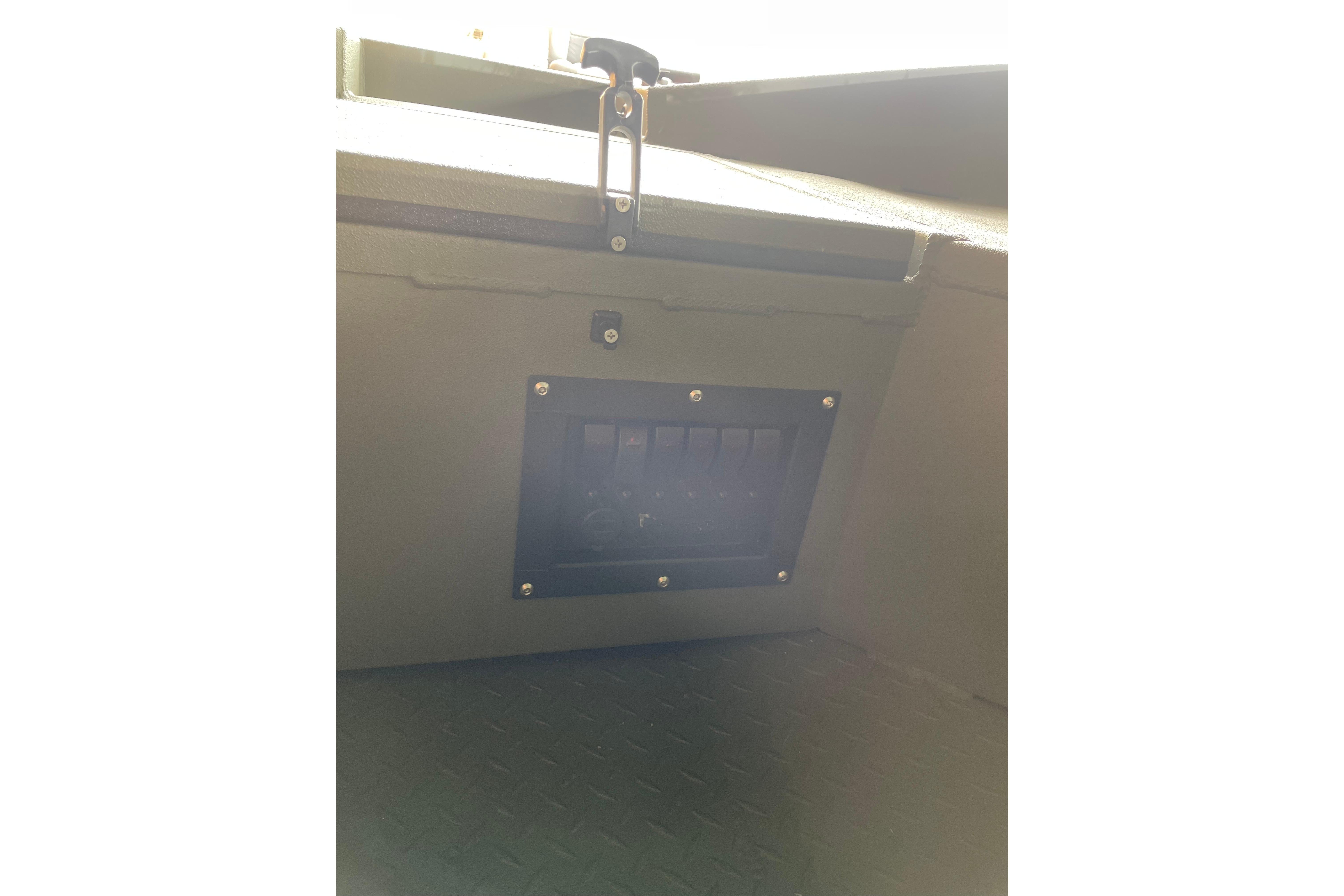 Interior view of 2026 Reaper Boats 753 Timber Reaper, featuring a control panel.