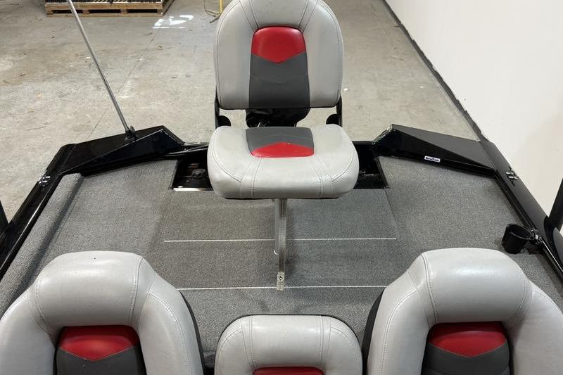 2016 Tracker Pro Team 175 TXW boat seats with gray and red upholstery.