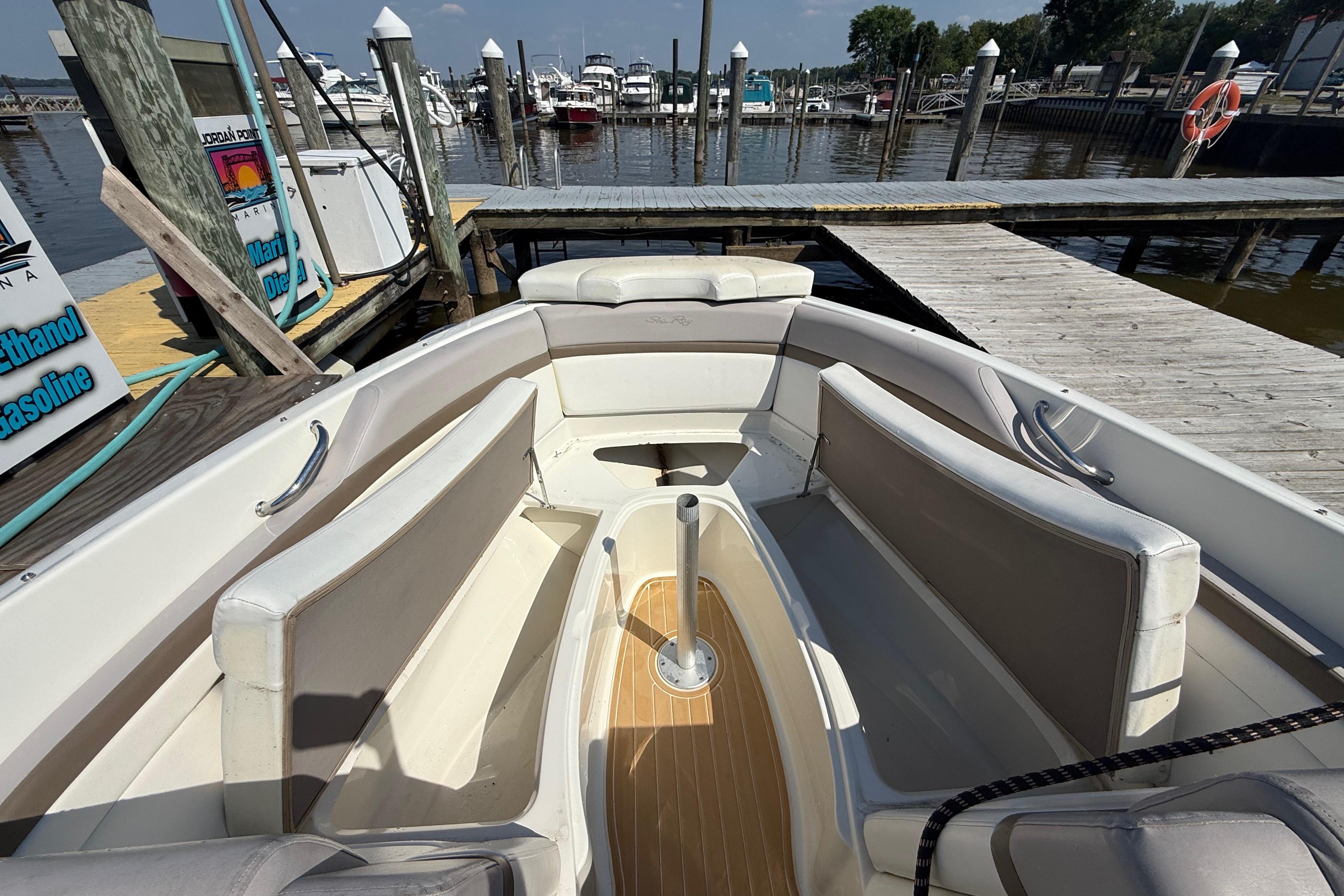 2011 Sea Ray 270 SLX boat interior at marina dock, featuring spacious seating.