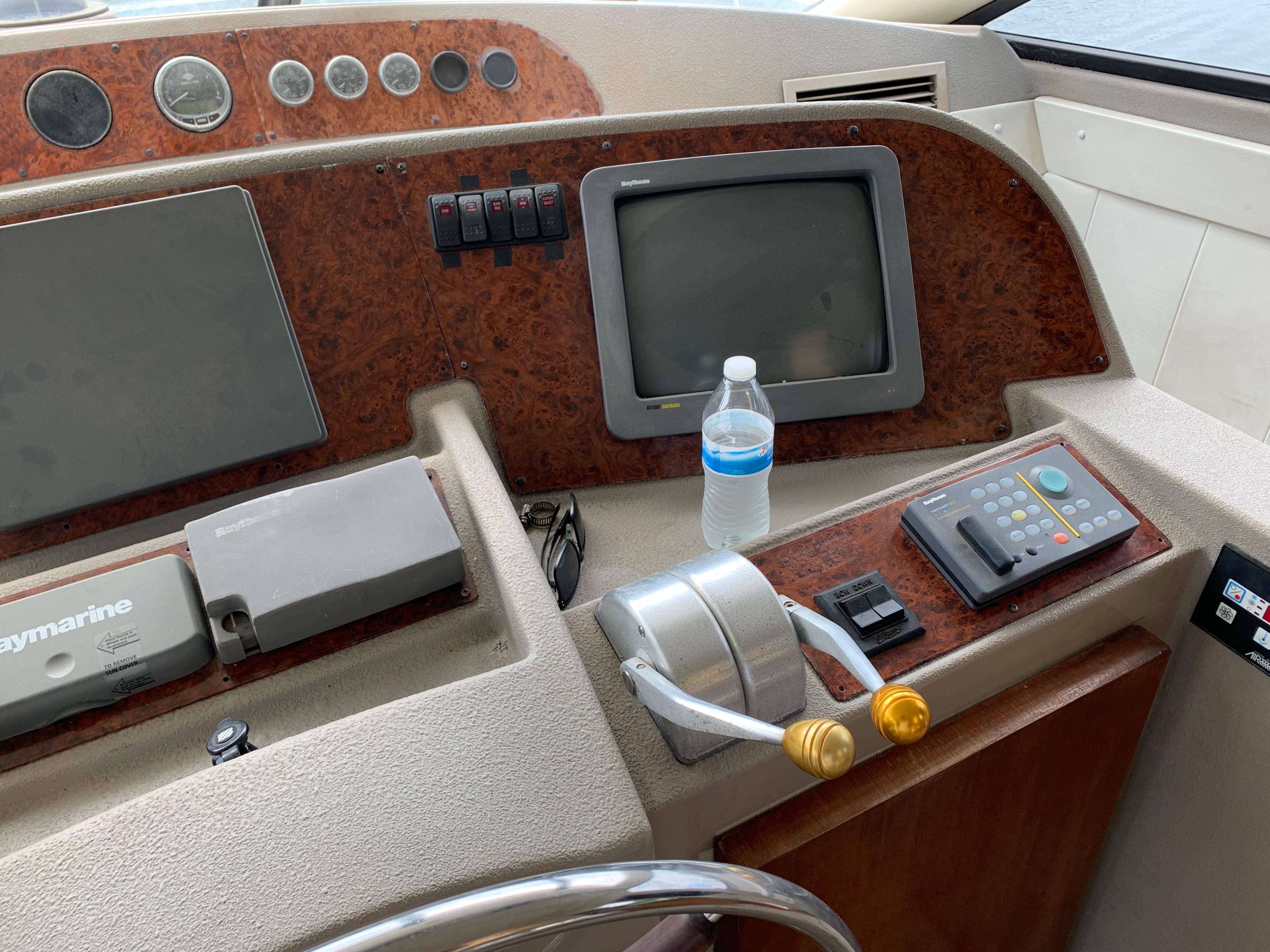 1999 Bayliner 5788 Pilot House Motoryacht helm with controls and navigation equipment.