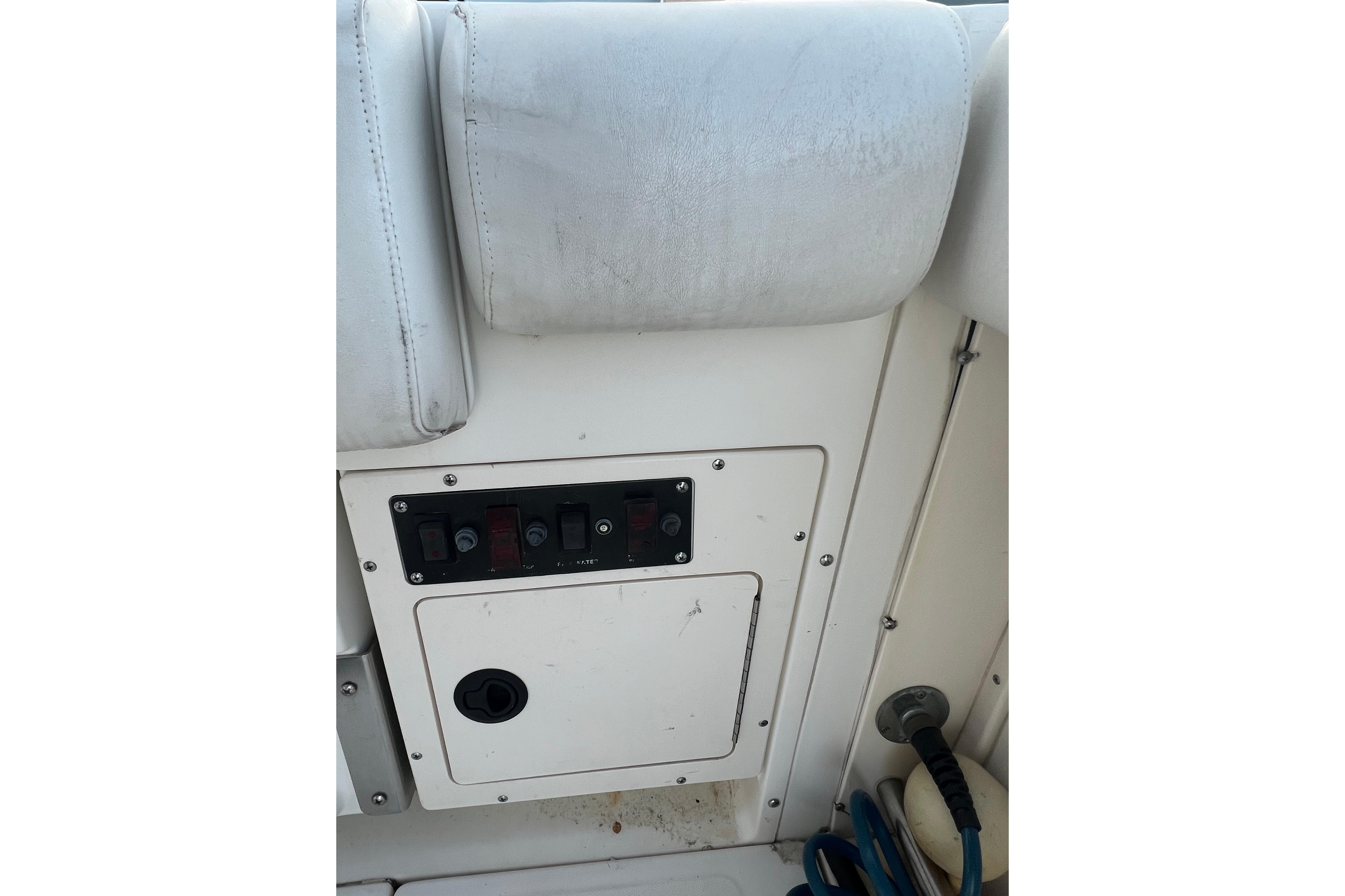 Control panel on a 1998 Boston Whaler Outrage 23 boat interior.