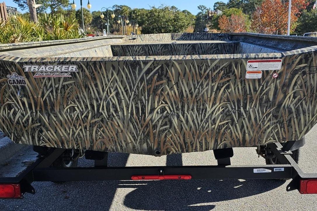 2025 Tracker Grizzly 1860 Utility boat with camo design on a trailer.