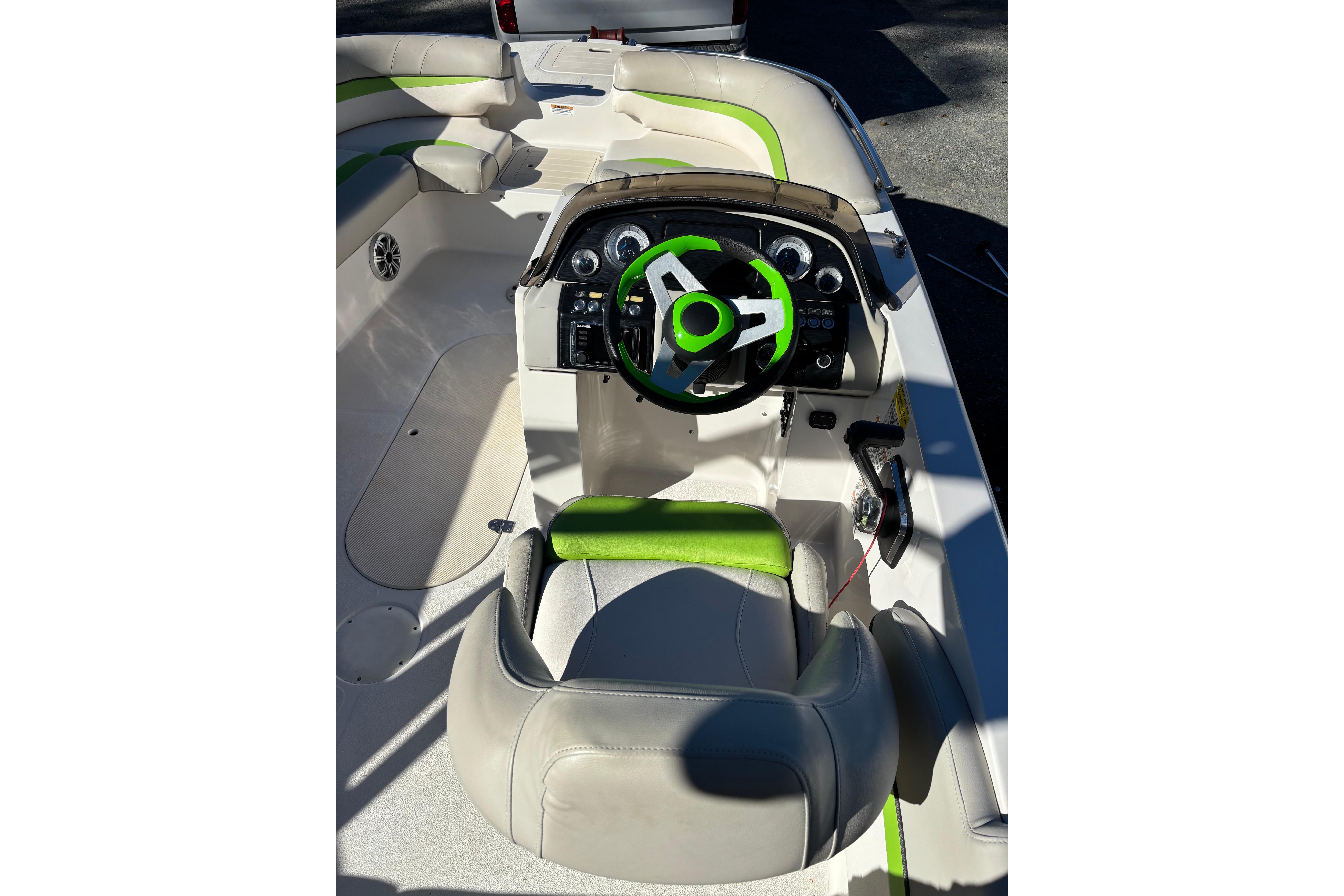 2018 Starcraft Star Step 221 I/O boat interior with green accents and steering wheel.