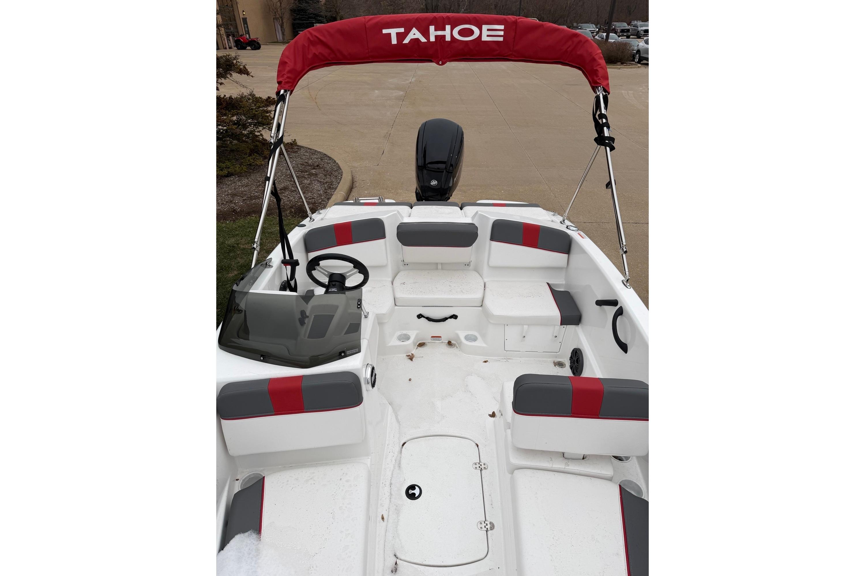 2025 Tahoe T16 boat interior with red and gray seating, steering wheel, and canopy.