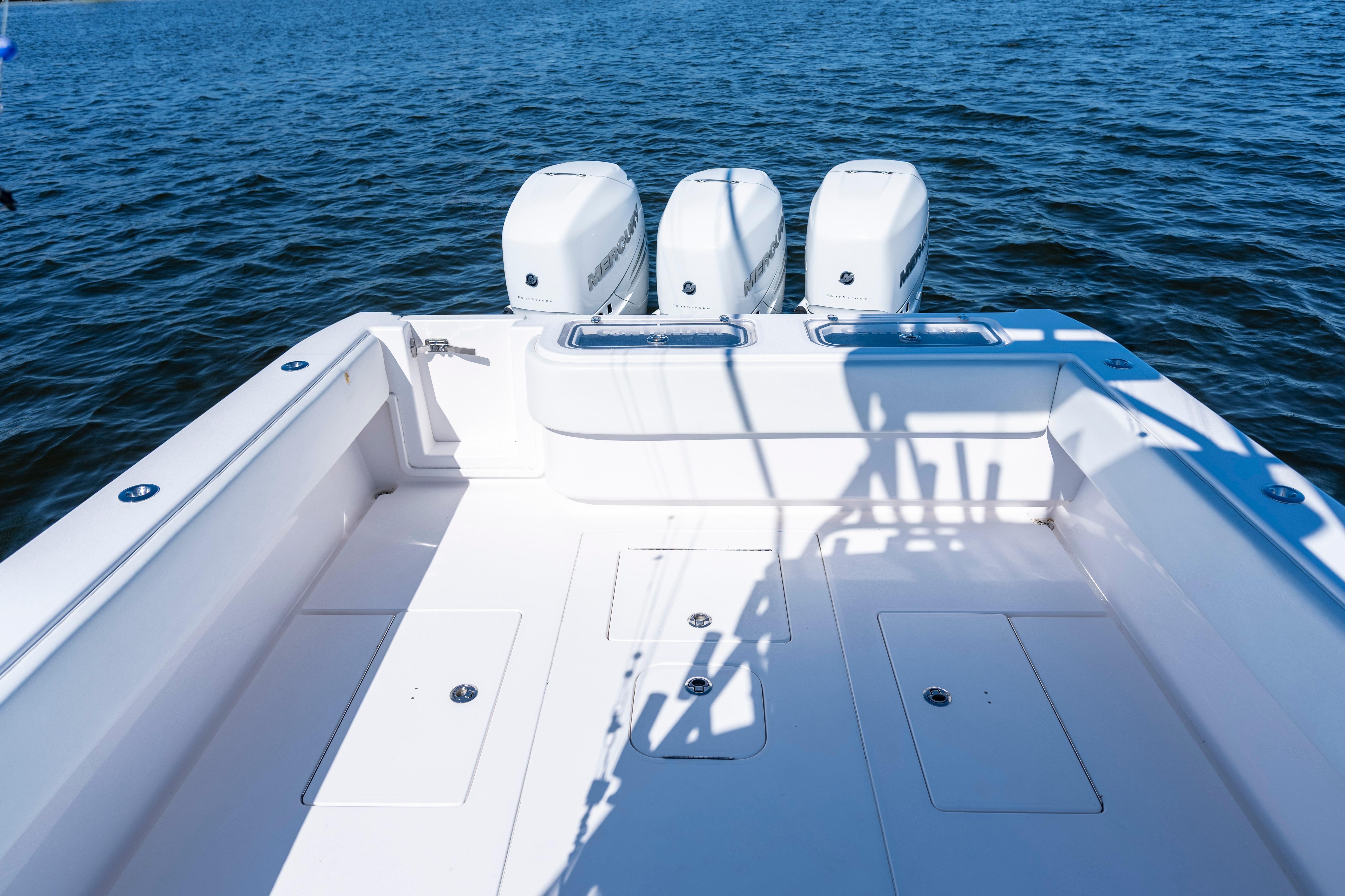 2015 Contender 39 ST boat with triple Mercury engines on open water.