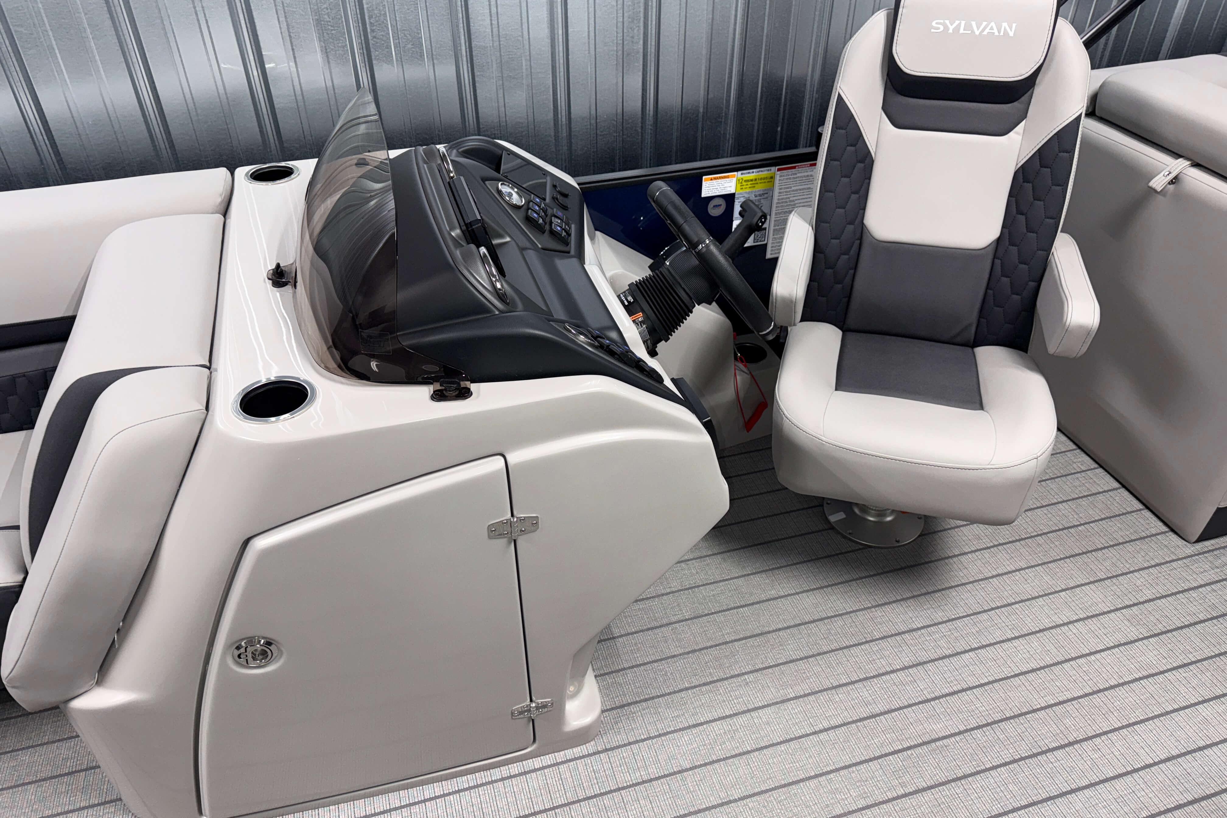 2026 Sylvan L3 SLZ boat interior with steering console and captain's chair.