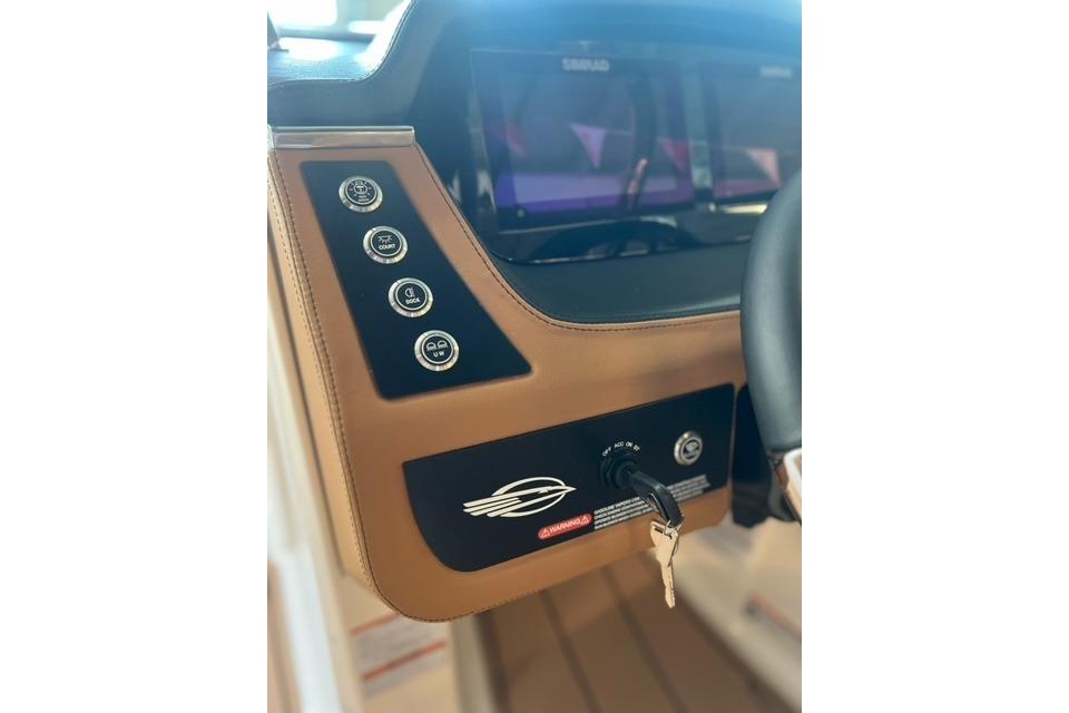 2025 Chaparral 247 SSX boat dashboard with controls and key ignition.