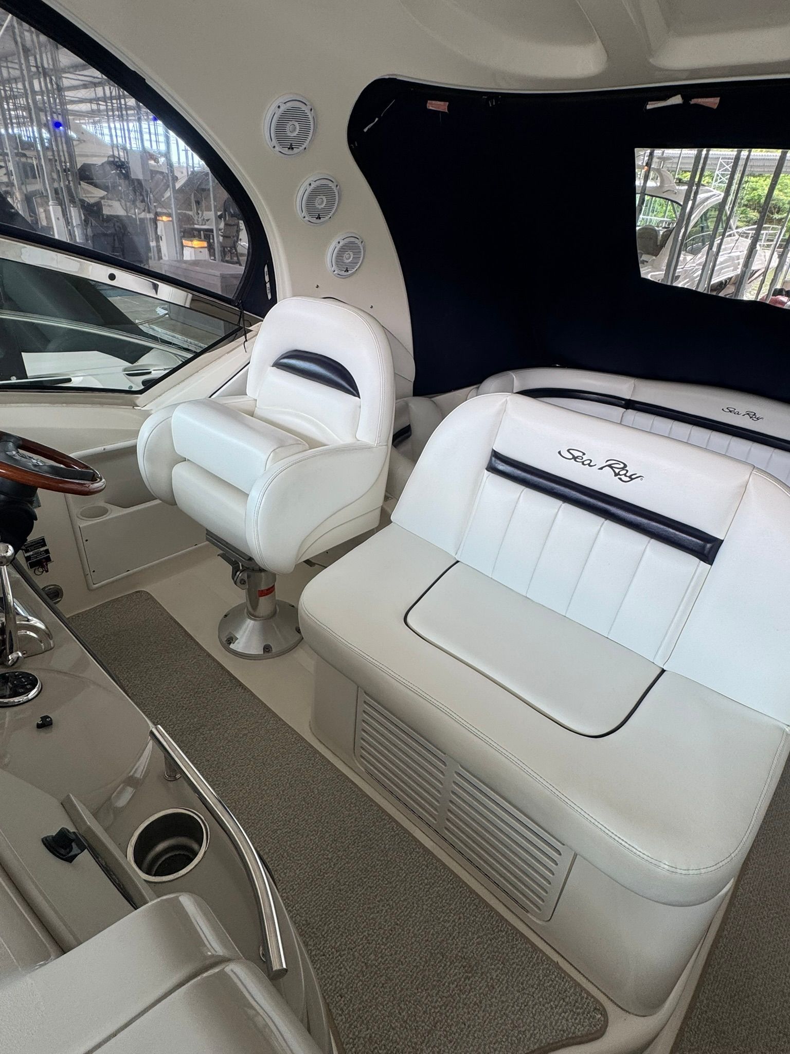 Interior of a 2007 Sea Ray 40 Sundancer with white leather seating.