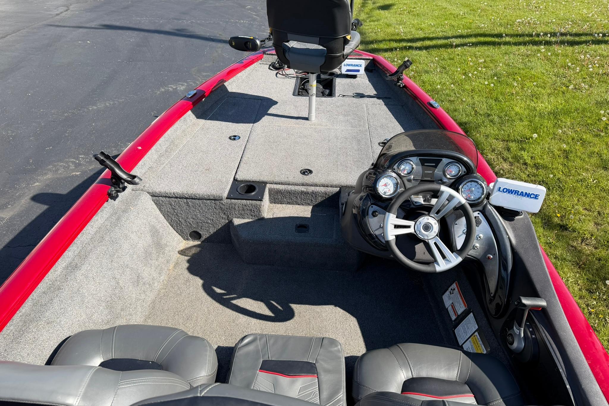 2024 Tracker Pro Team 175 TXW boat interior with steering console and seating.