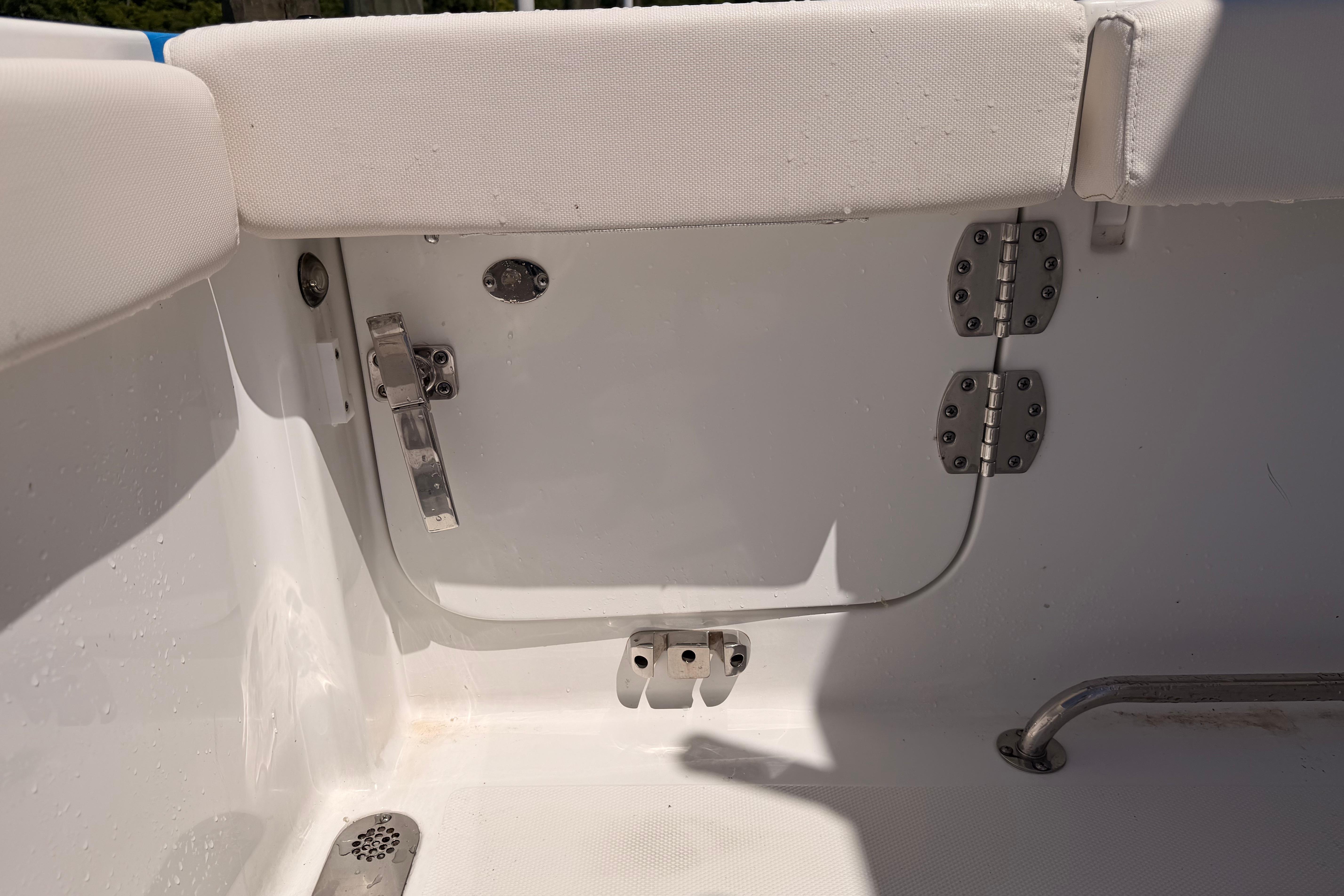 Interior view of 2024 Sea Hunt Gamefish 27 Coffin Box boat, featuring seating and hardware.