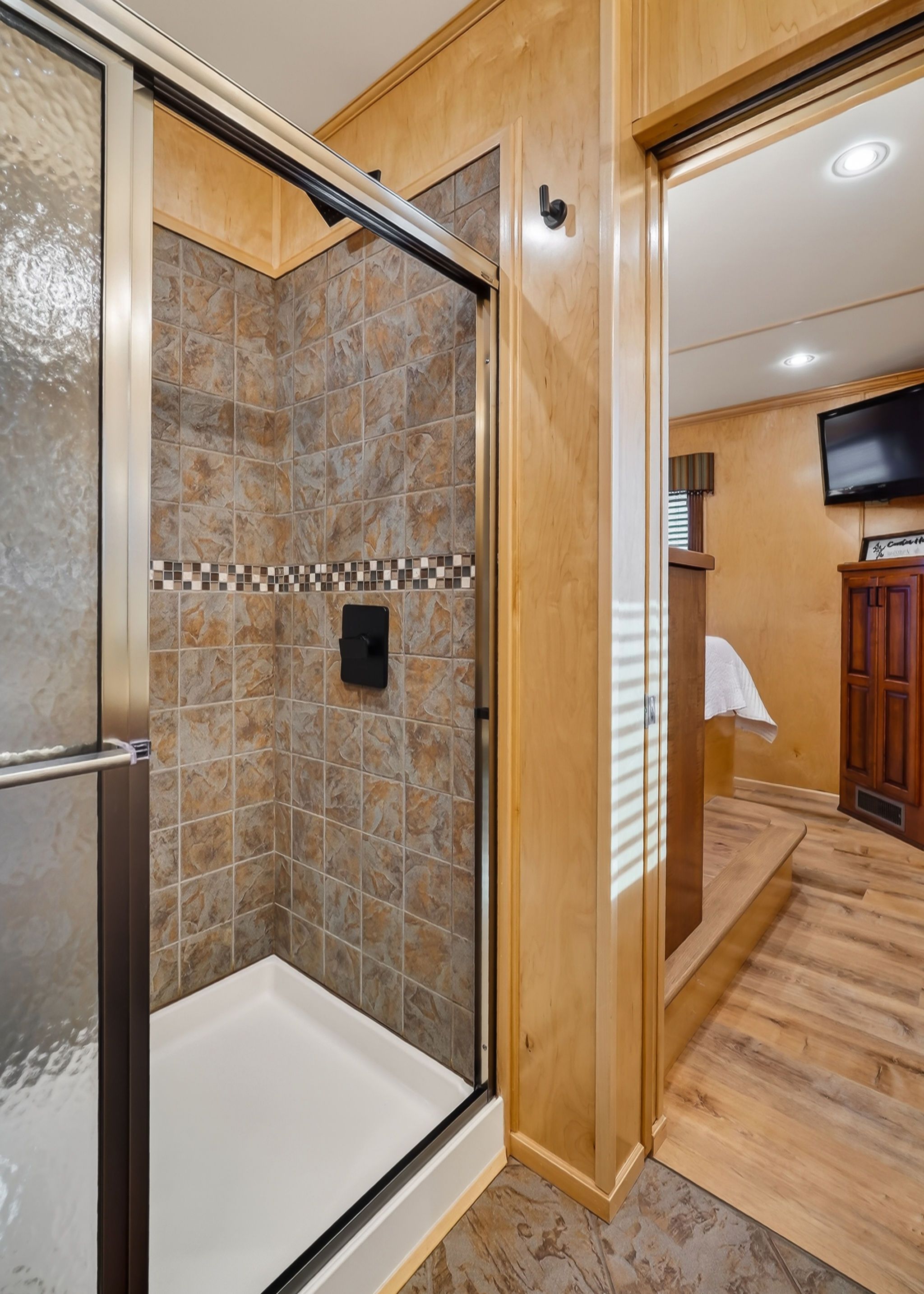 Houseboat shower with tile and wood accents, model Throughbred 2010.