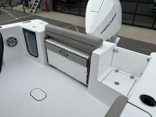 2025 Sportsman Open 232 boat interior with seating and Mercury engine.