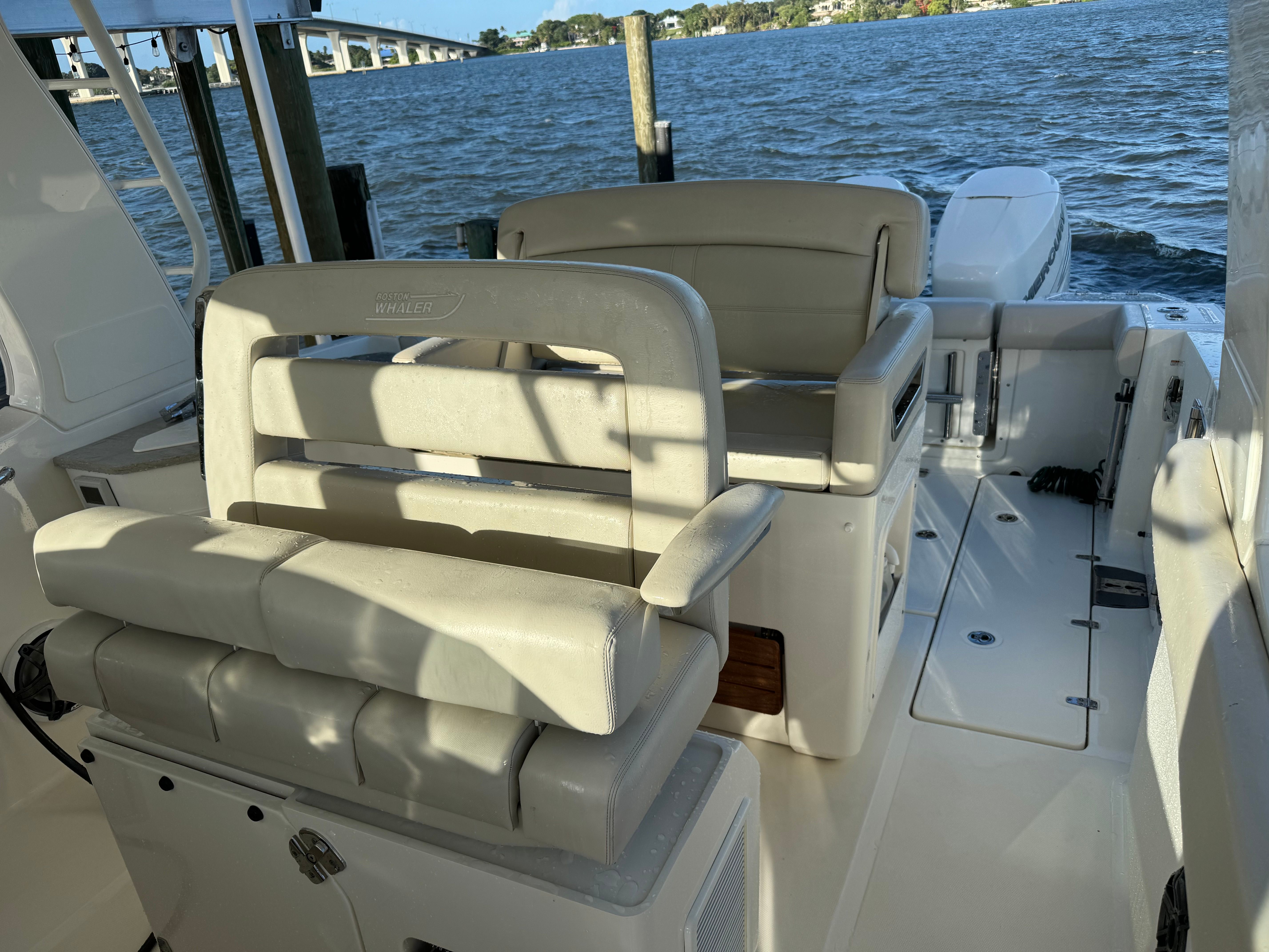 Interior of a 2020 Boston Whaler 350 Realm boat by the water.