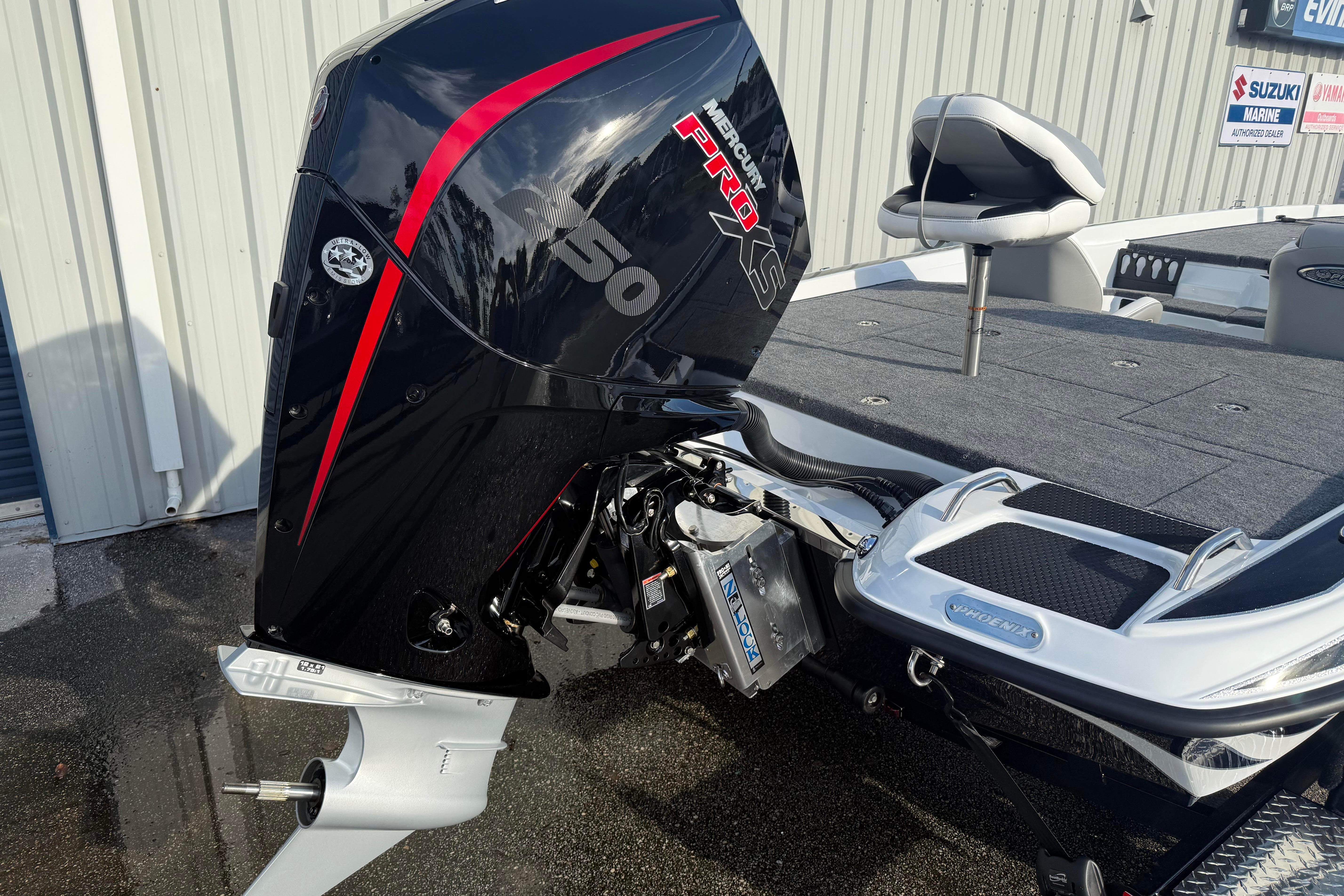 2027 Phoenix 721 ZXL boat with Mercury Pro XS 250 engine, parked outdoors.