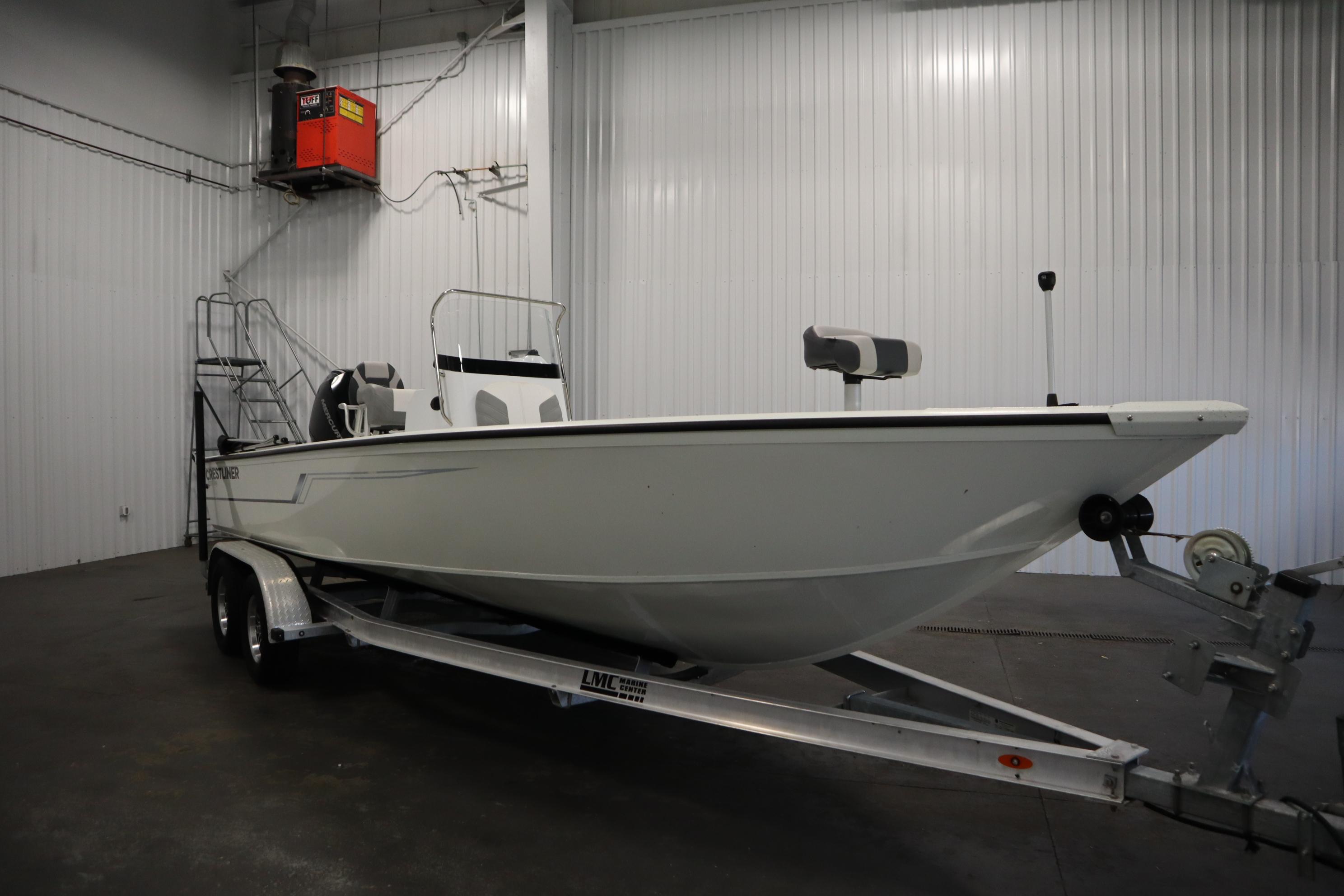 2022 Crestliner 2200 CC boat on trailer in indoor storage facility.