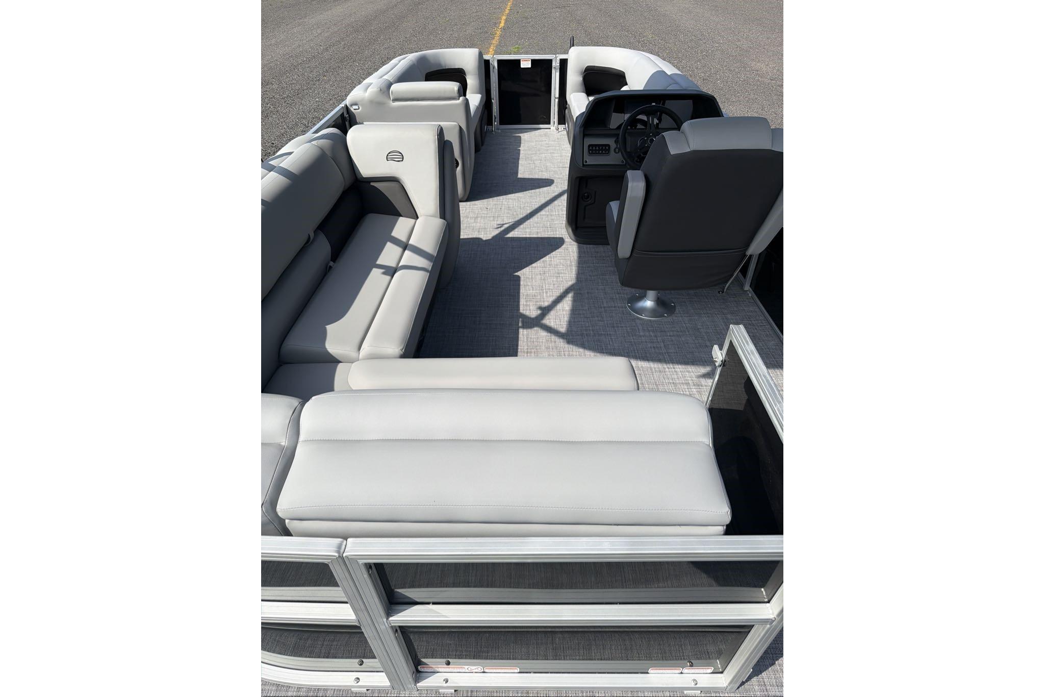 2026 Sun Tracker Party Barge 20 DLX interior with spacious seating and modern helm.