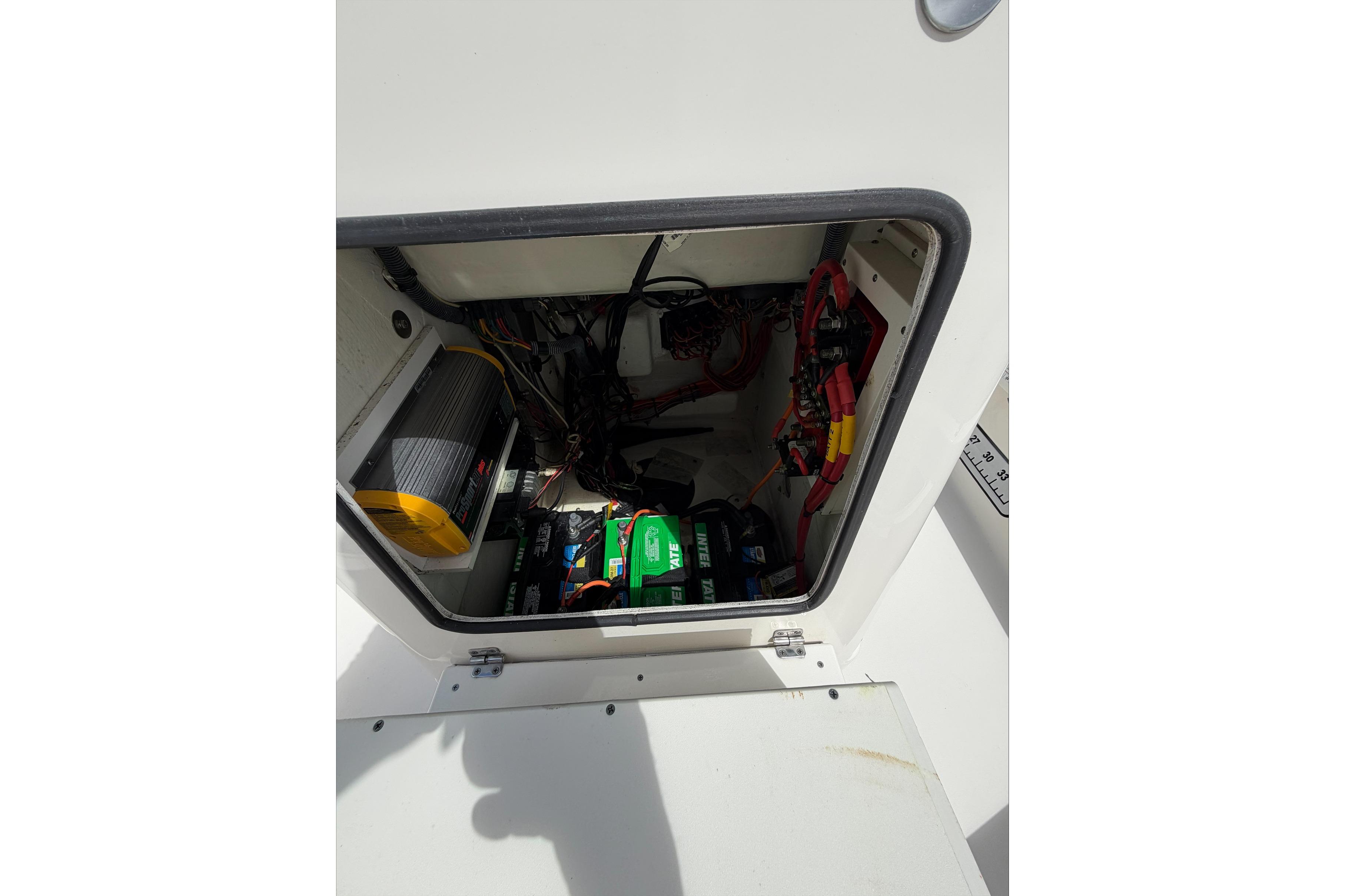 2017 Pathfinder 2200 TRS boat compartment with battery and wiring.