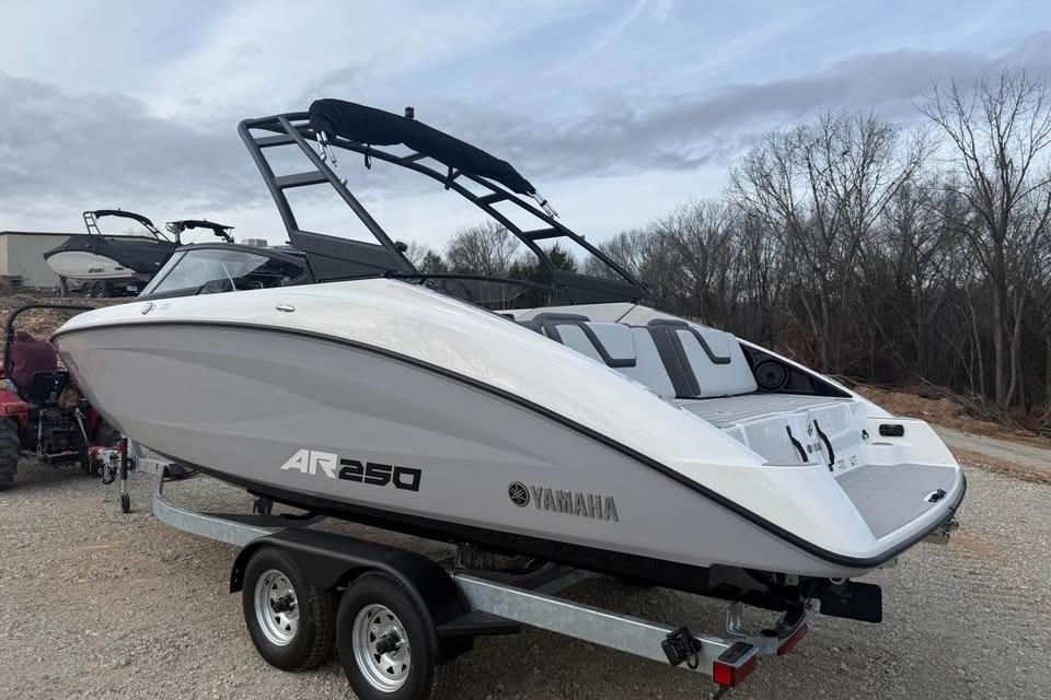 2026 Yamaha Boats AR250 on trailer, sleek design, outdoor setting.