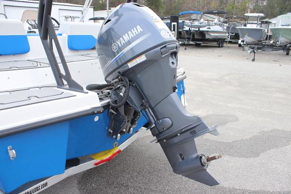2025 Starcraft SV 16 OB boat with Yamaha outboard motor, parked in a marina.