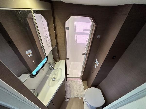 Modern bathroom in 2021 Bali 4.8 yacht with shower, sink, and toilet.