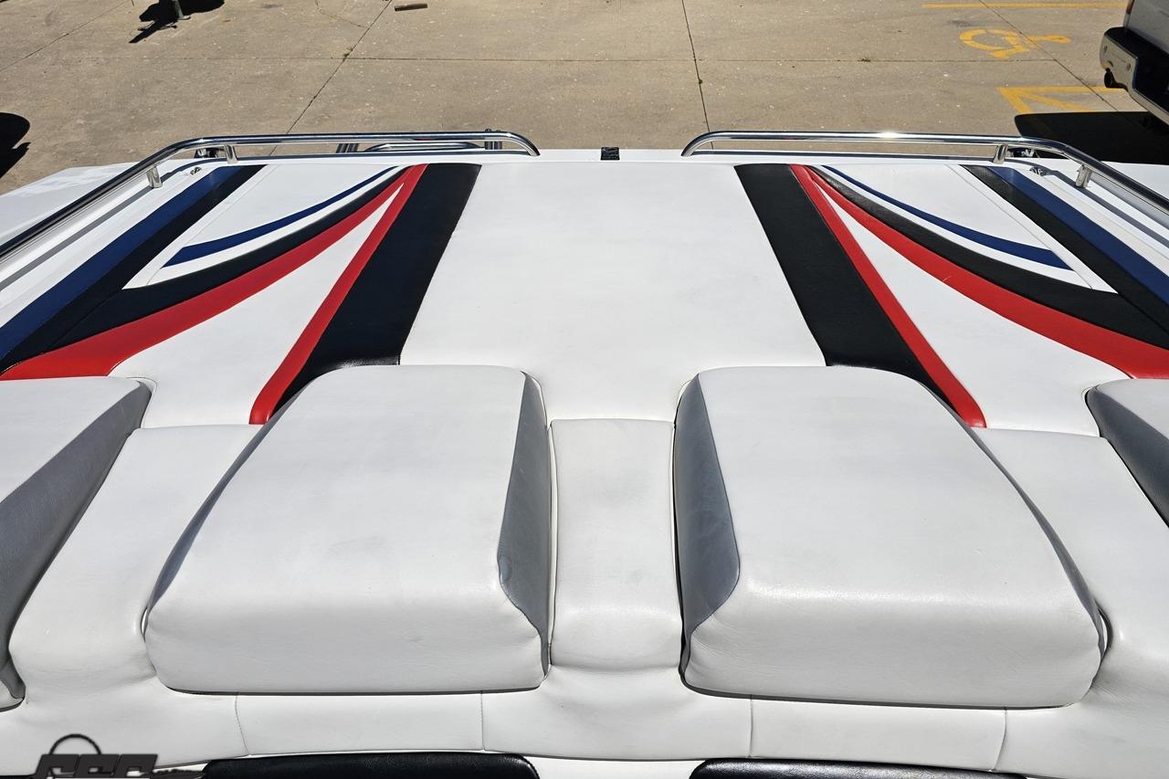 2005 Formula 271 FASTech boat with sleek white and red upholstery design.