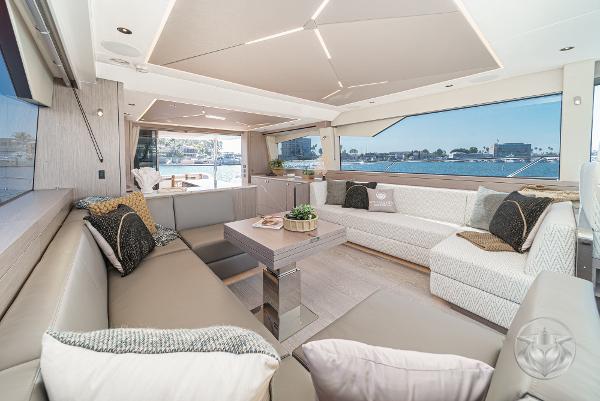 Luxurious interior of 2025 Sunseeker Manhattan 68 yacht with elegant seating and panoramic windows.
