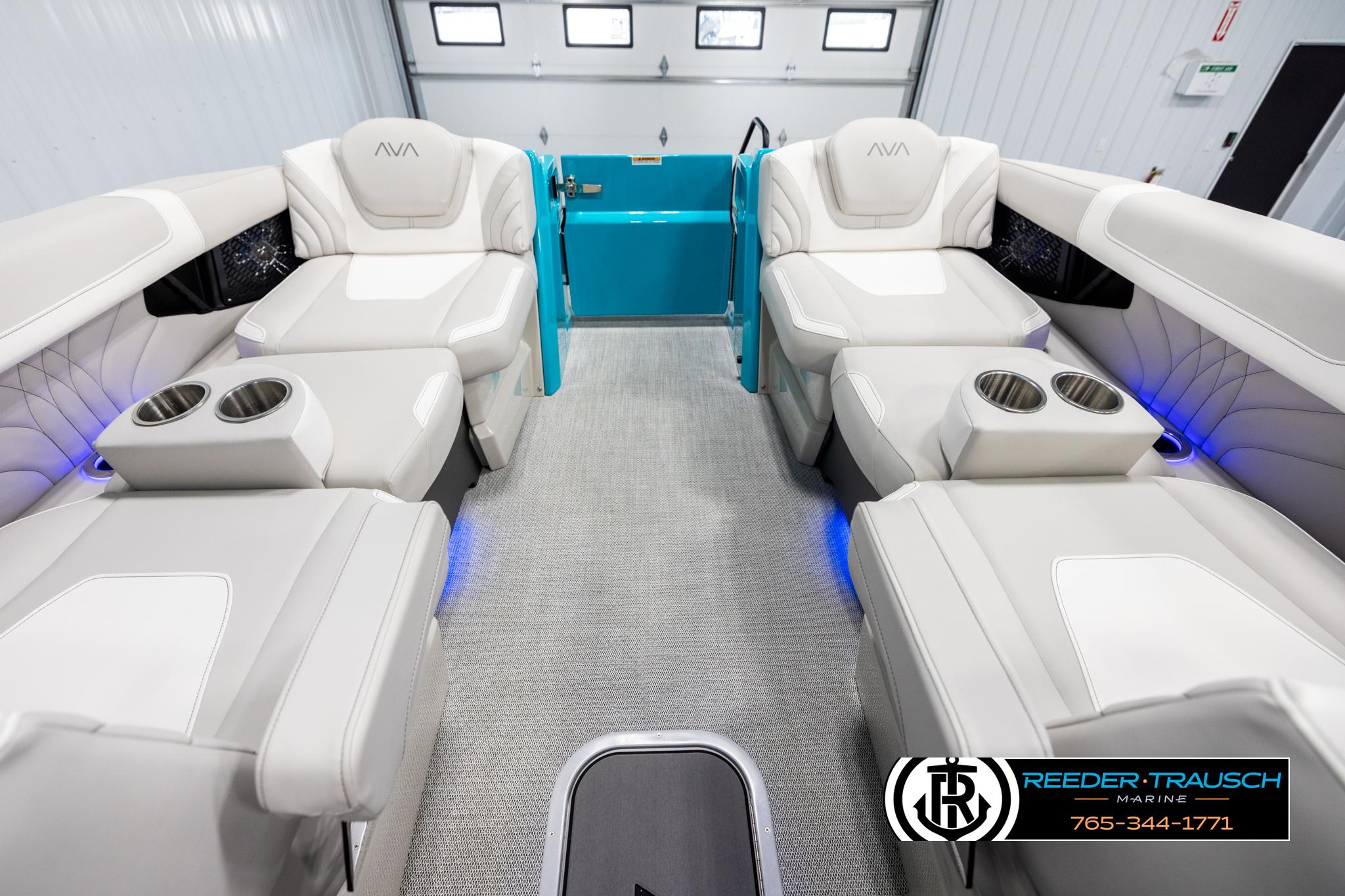Luxurious interior of 2025 Avalon 2585 Excal VRBW boat with plush seating and cup holders.