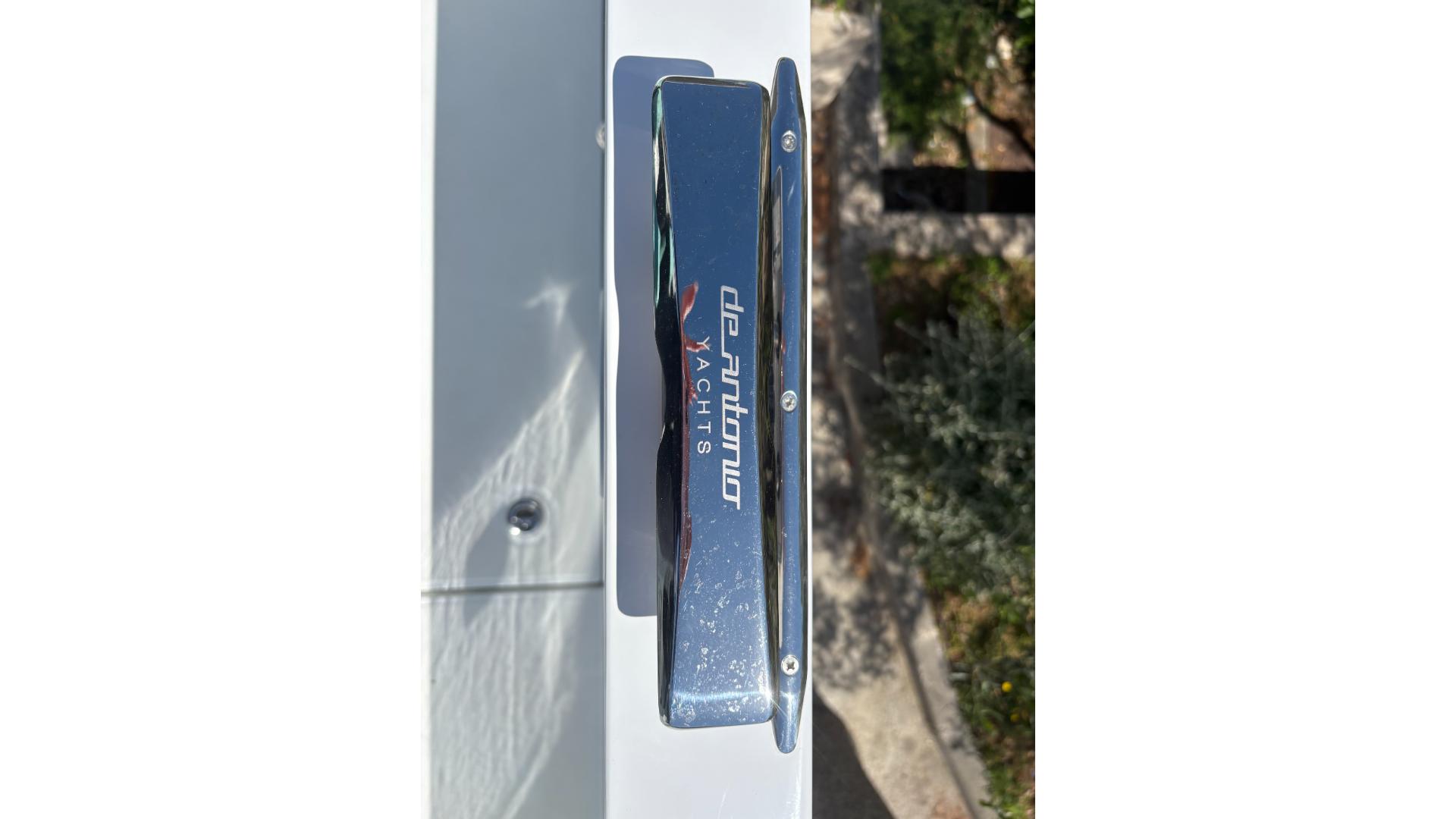 2025 De Antonio Yachts e23 Open, chrome detail, outdoor setting.