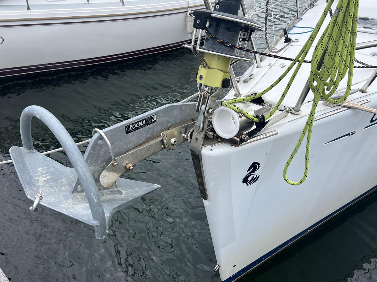 Bow of 2001 Beneteau First 40.7 sailboat with Rocna anchor and green ropes.