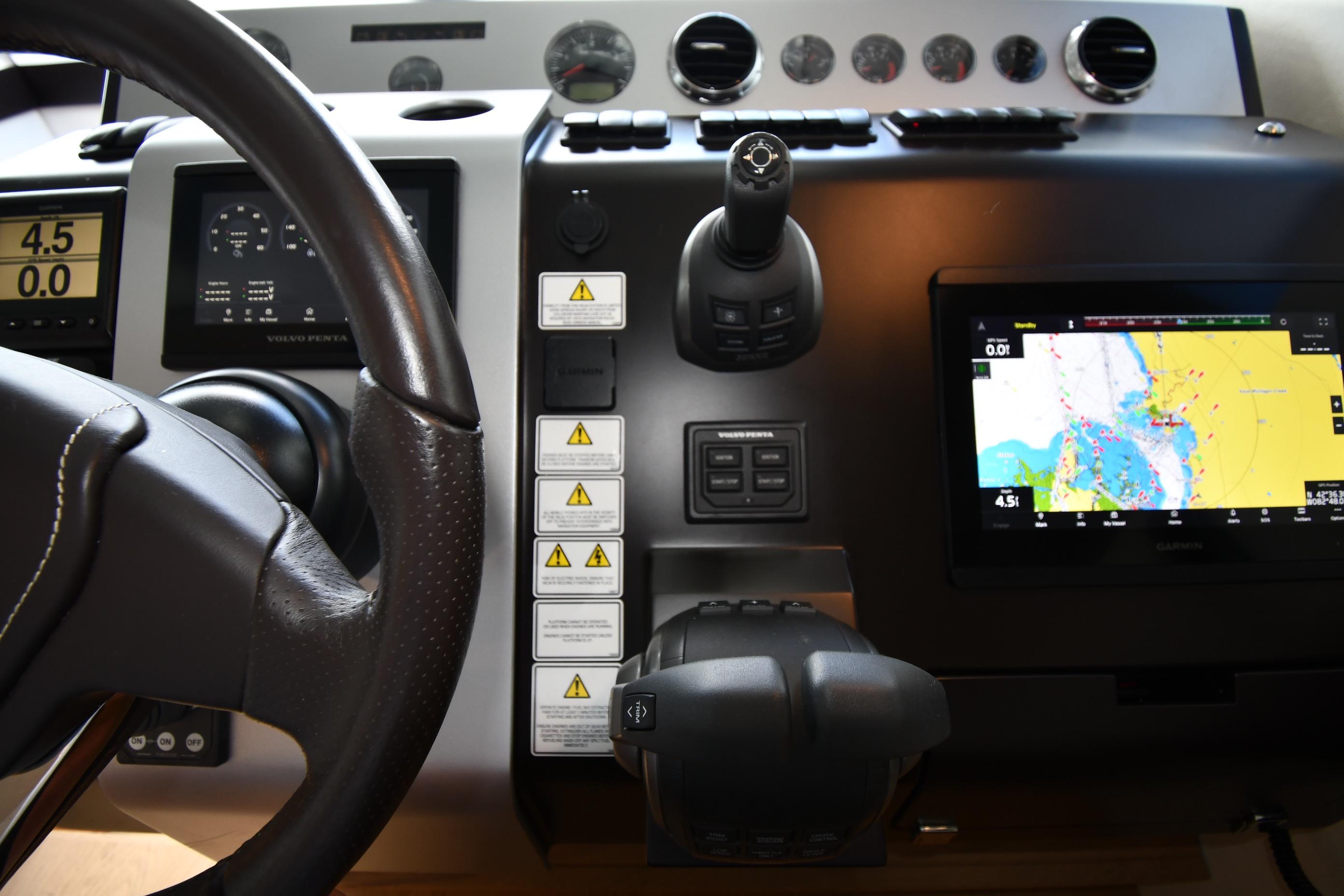 Cockpit of 2024 Fairline G50 Targa yacht with navigation and control systems.