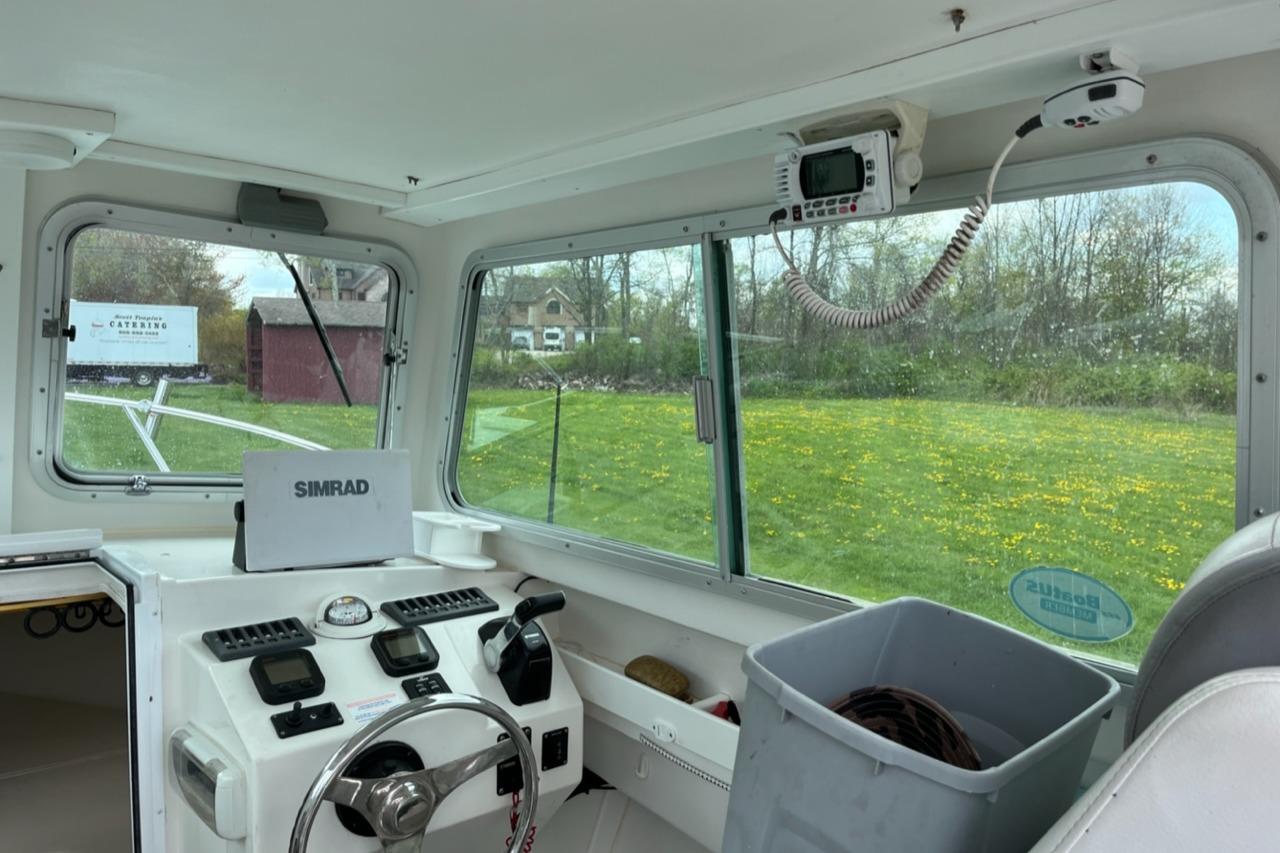 Interior of a 2012 Steiger Craft Miami boat with Simrad navigation system.