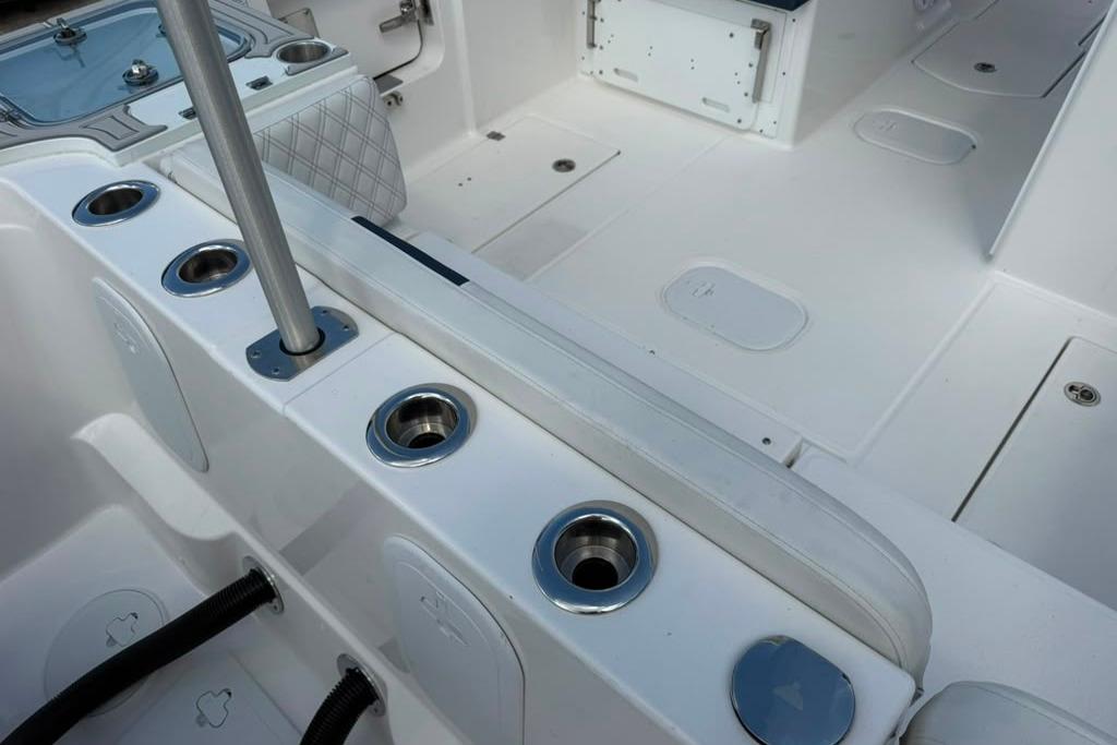 Interior view of 2026 Sea Fox 288 Traveler boat, showcasing rod holders and seating area.