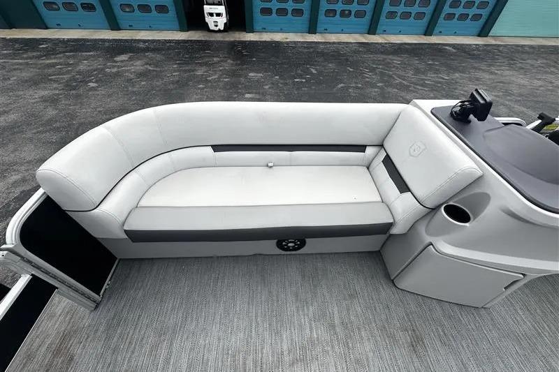2023 Godfrey 2286 boat interior with white seating and control panel.