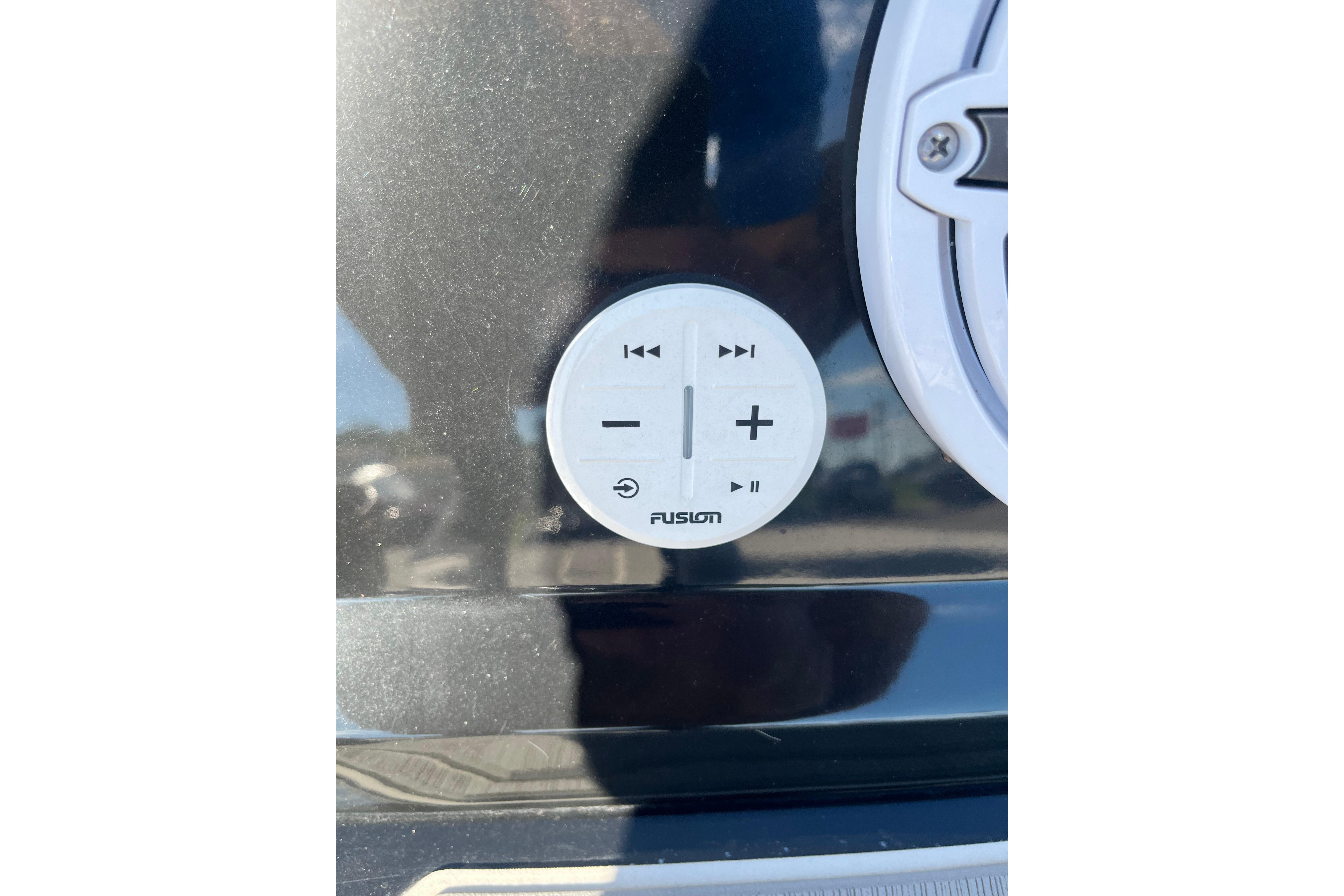 Control panel on 2024 Regal LS9 Surf boat, featuring Fusion audio controls.