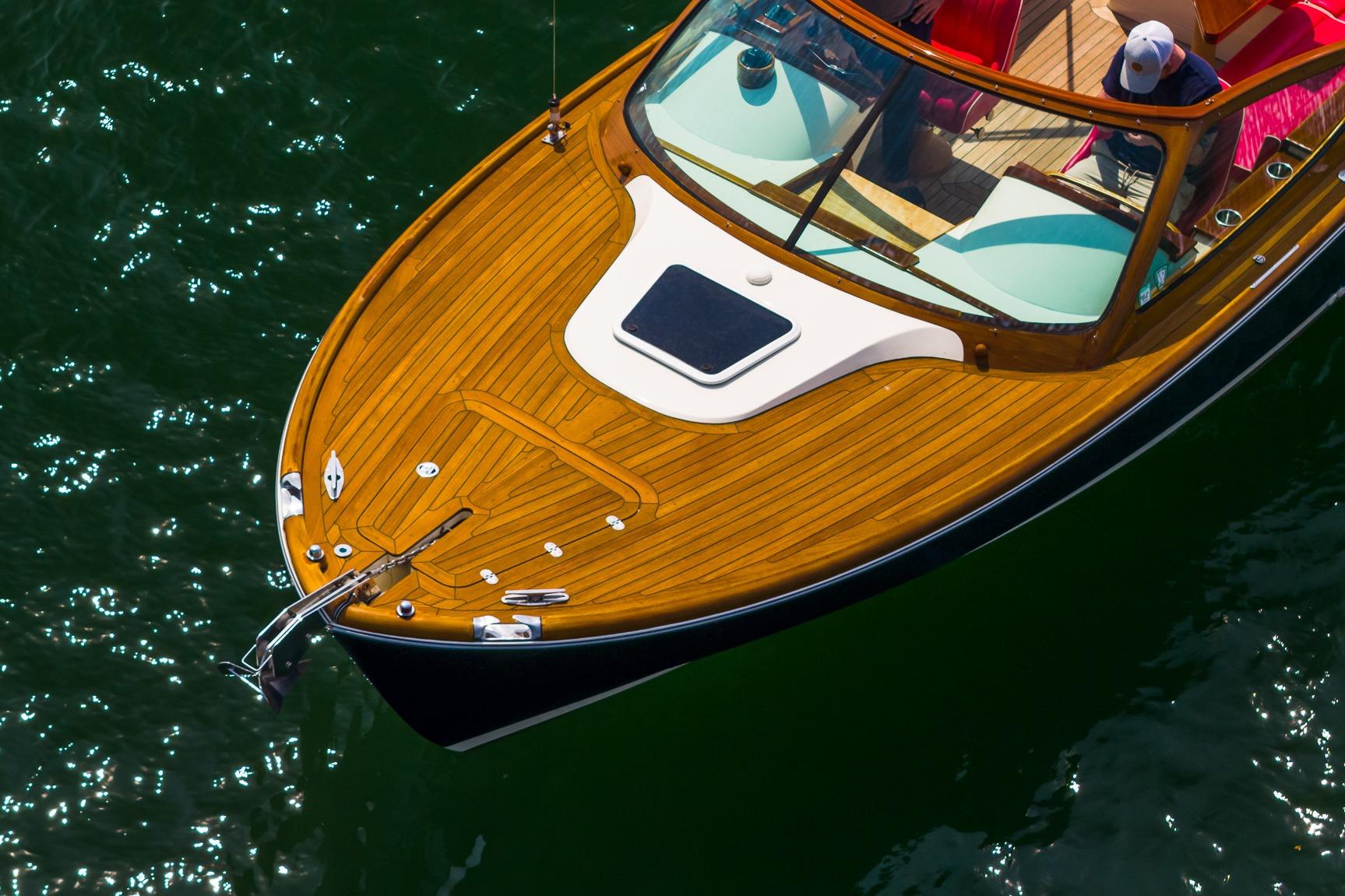 2005 Hinckley Talaria 29R boat with elegant wooden deck on calm water.