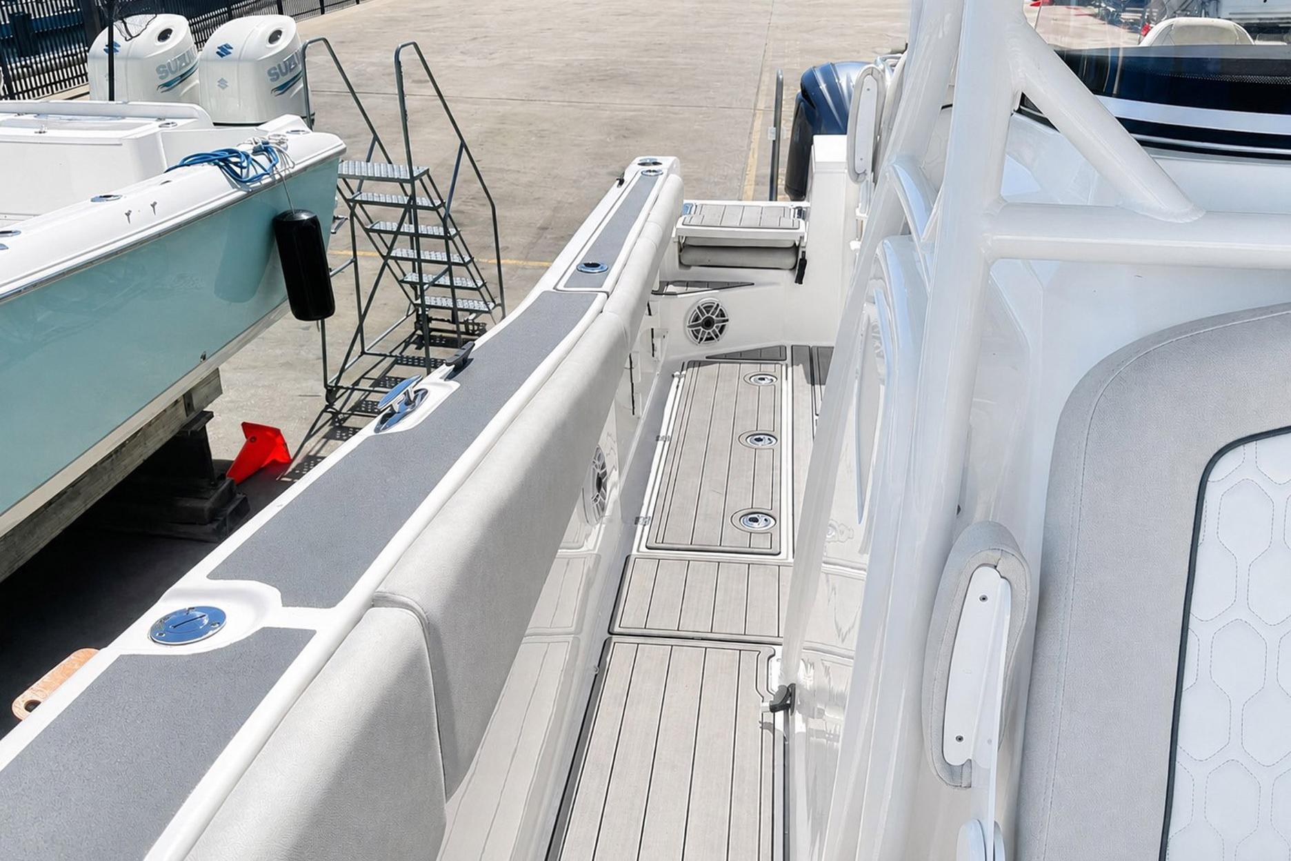 Sea Fox 228 Commander 2002 boat interior with sleek seating and deck details.
